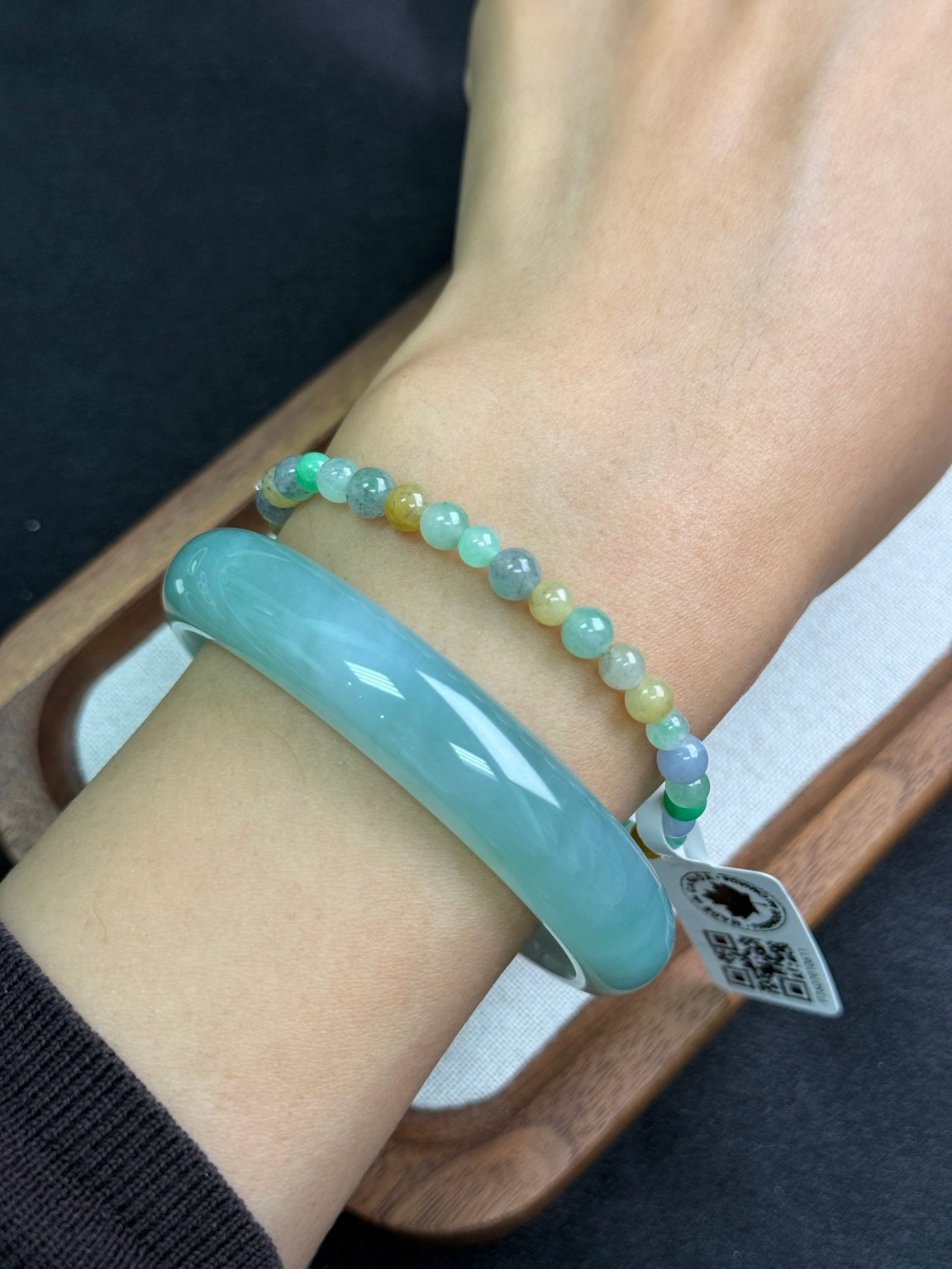 4 mm multicolour jadeite bead bracelet styled beside a separate bangle, bangle not included