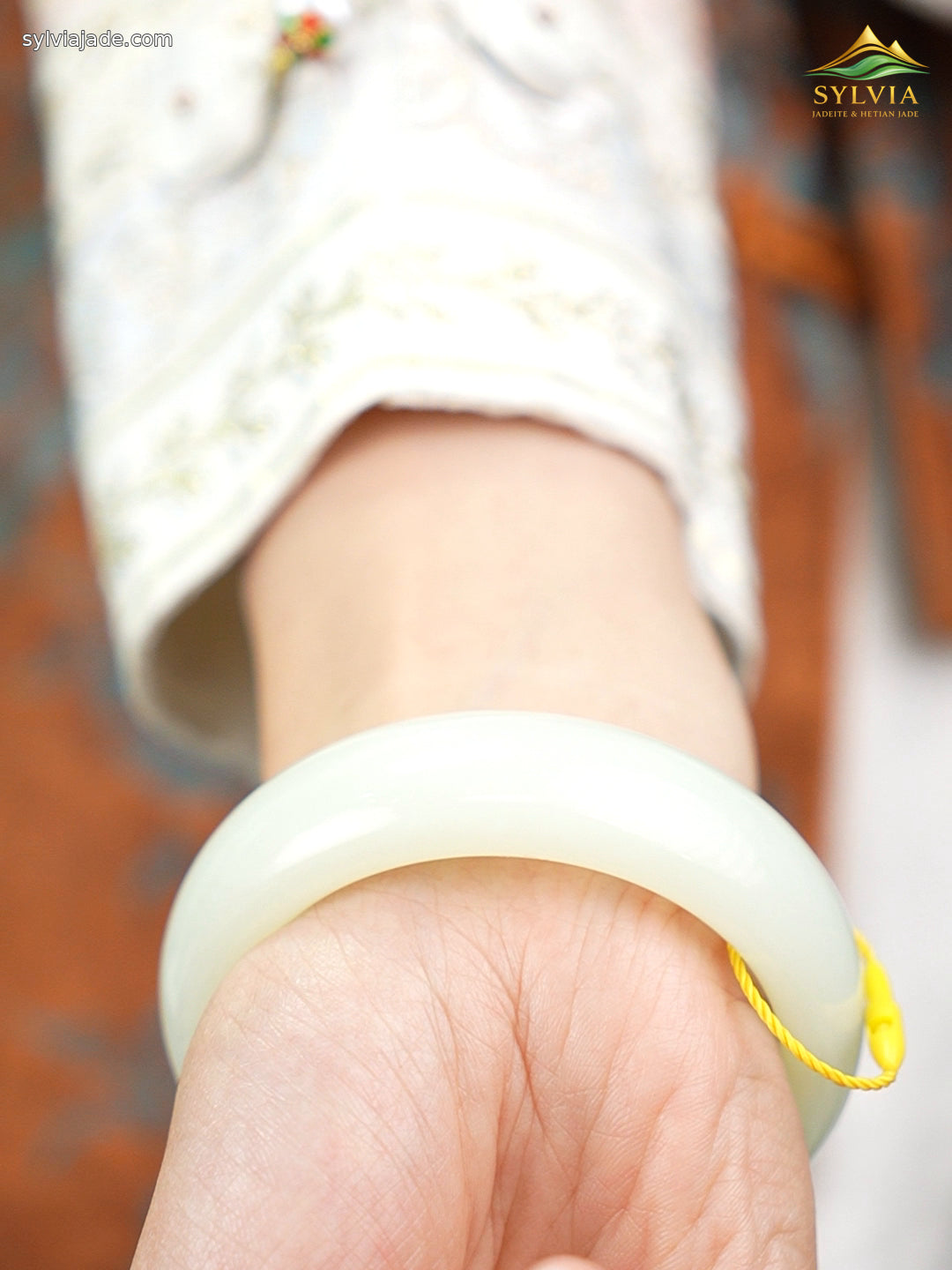 Pale green-white Hetian nephrite jade bangle B12609024874, worn angle 4