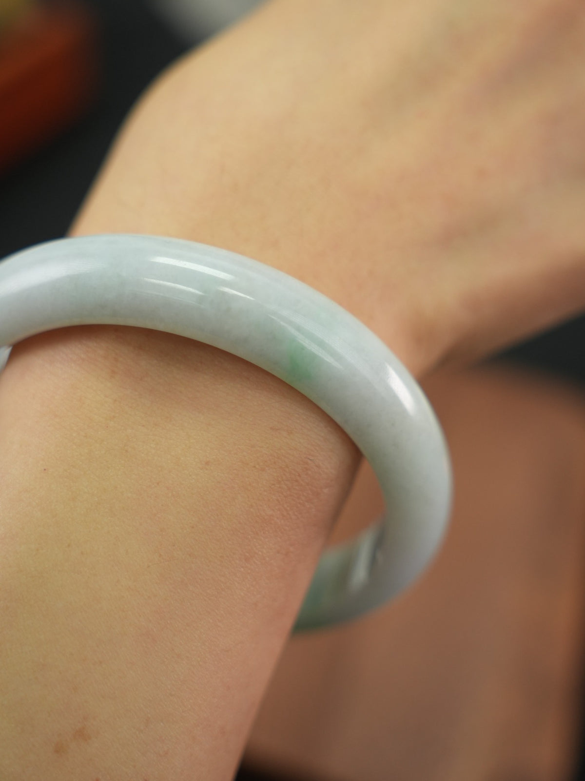 Natural Type A jadeite bangle, pale green and lavender, 61 mm
