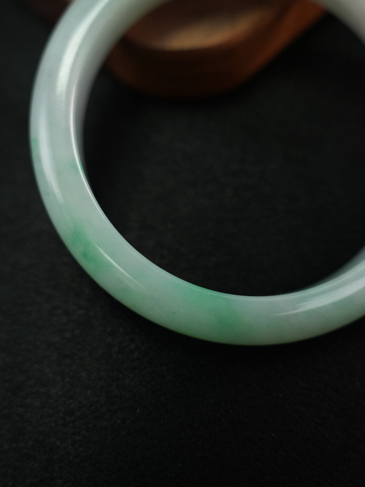 Natural Type A jadeite bangle, pale green and light lavender, 58 mm