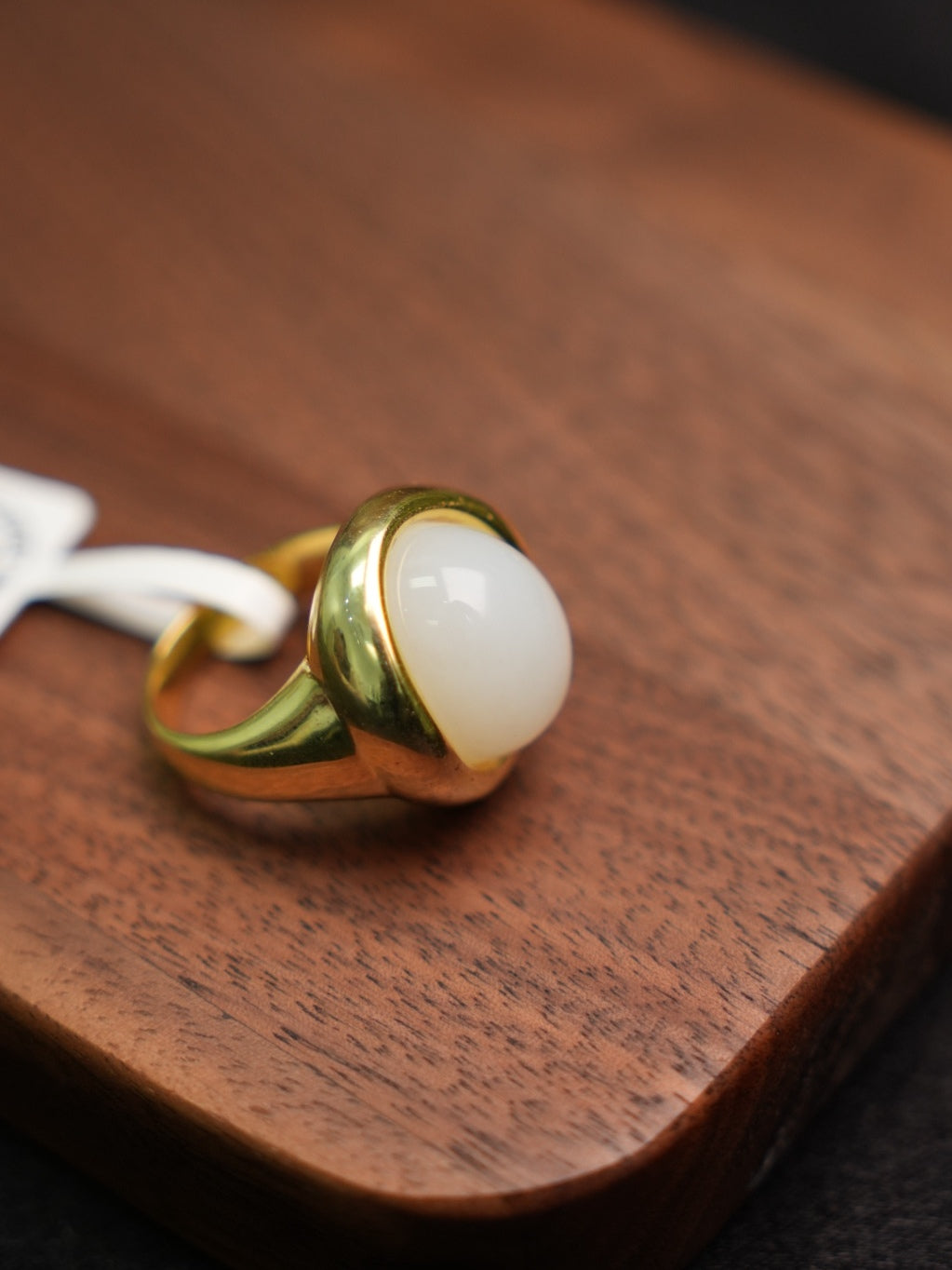 P2609002911 white Hetian nephrite jade ring in a gold-tone silver setting