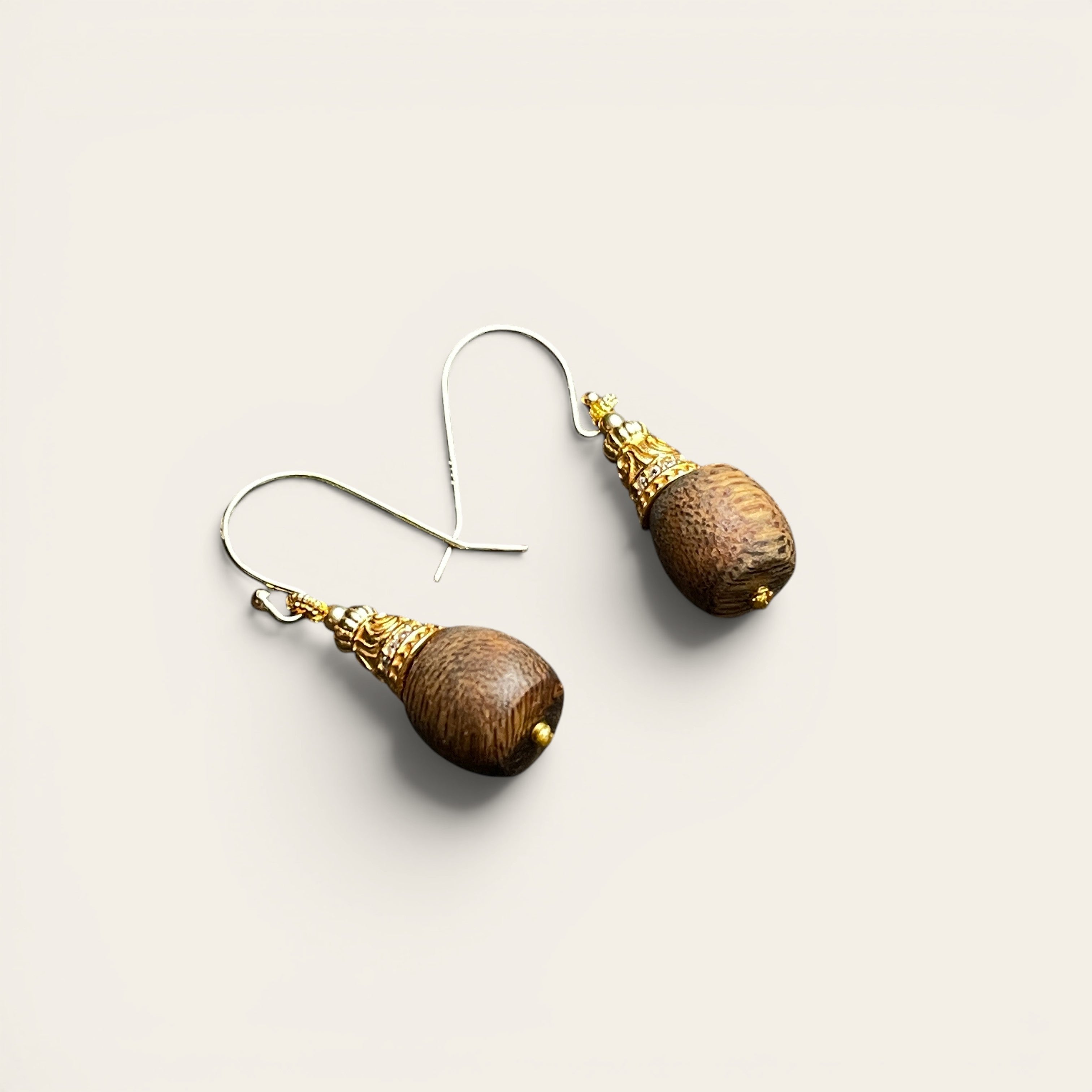 Sylvia Jewelry Zen Drop earrings featuring natural agarwood droplets with crystal-paved gold filigree caps on wire hooks.