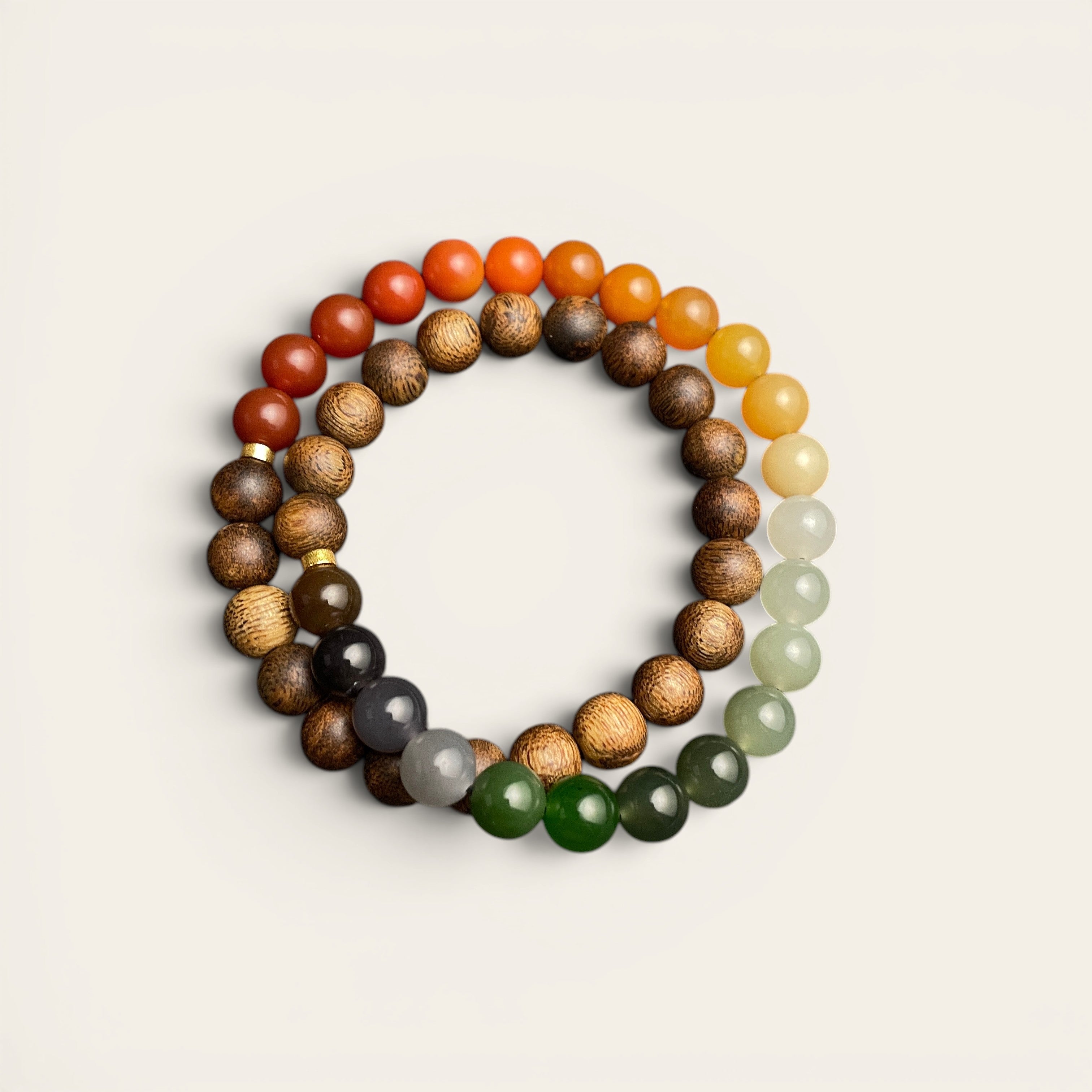 Sylvia Jewelry multi-wrap bracelet featuring natural agarwood beads and a gradient of multi-colored Hetian nephrite jade.