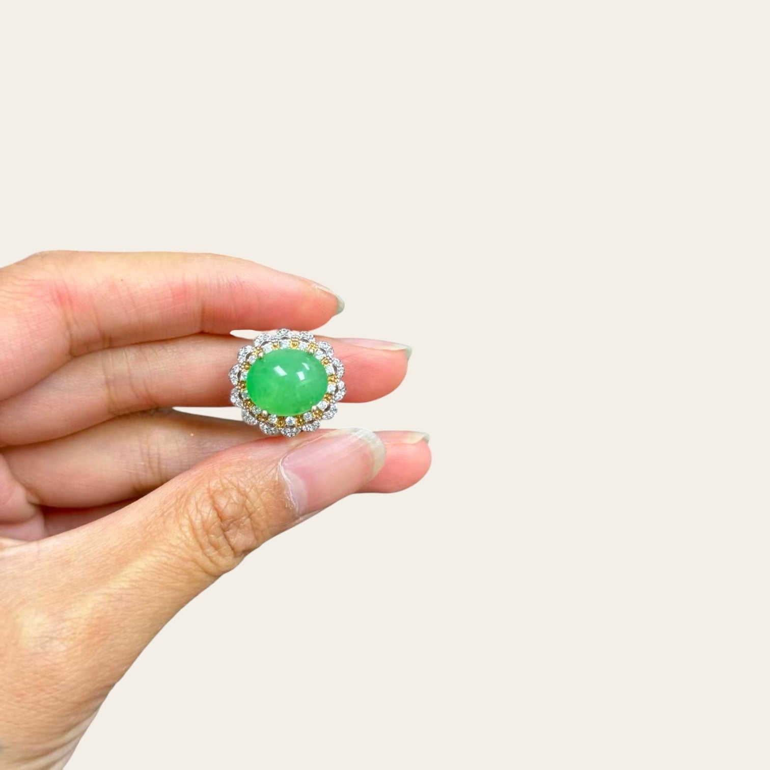 Sylvia Jewelry apple green jadeite cabochon ring with a two-tone gold-plated silver floral halo and crystal accents.