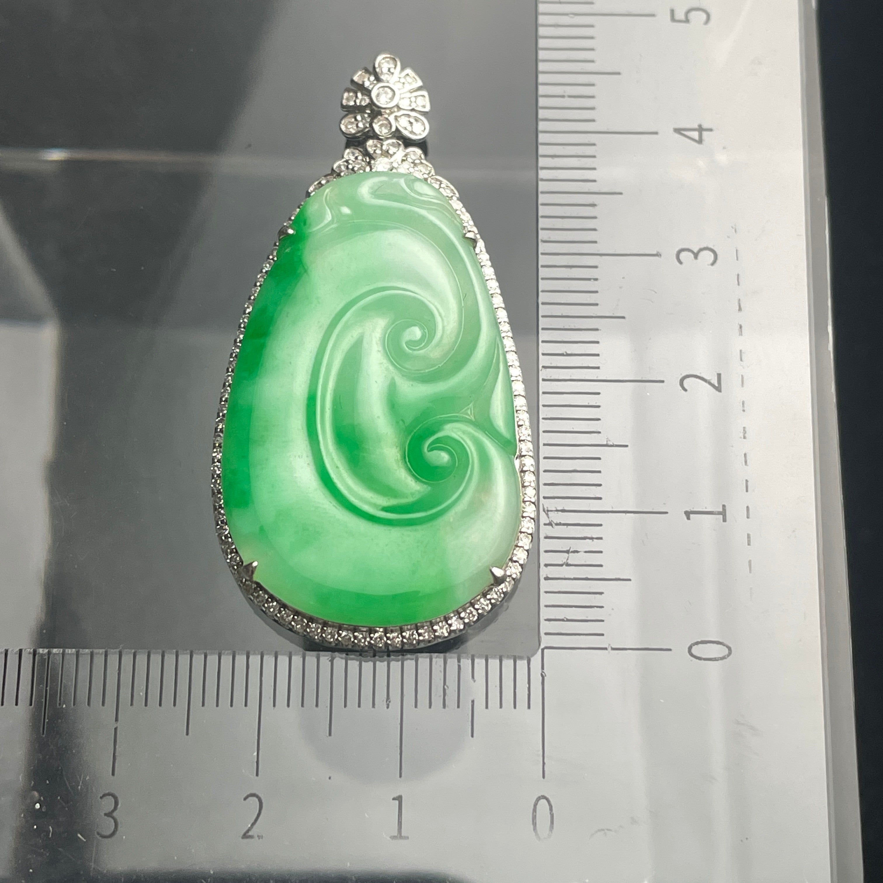 Sylvia Jewelry natural green Type A jadeite jade pendant with spiral carving and 18K gold diamond setting.