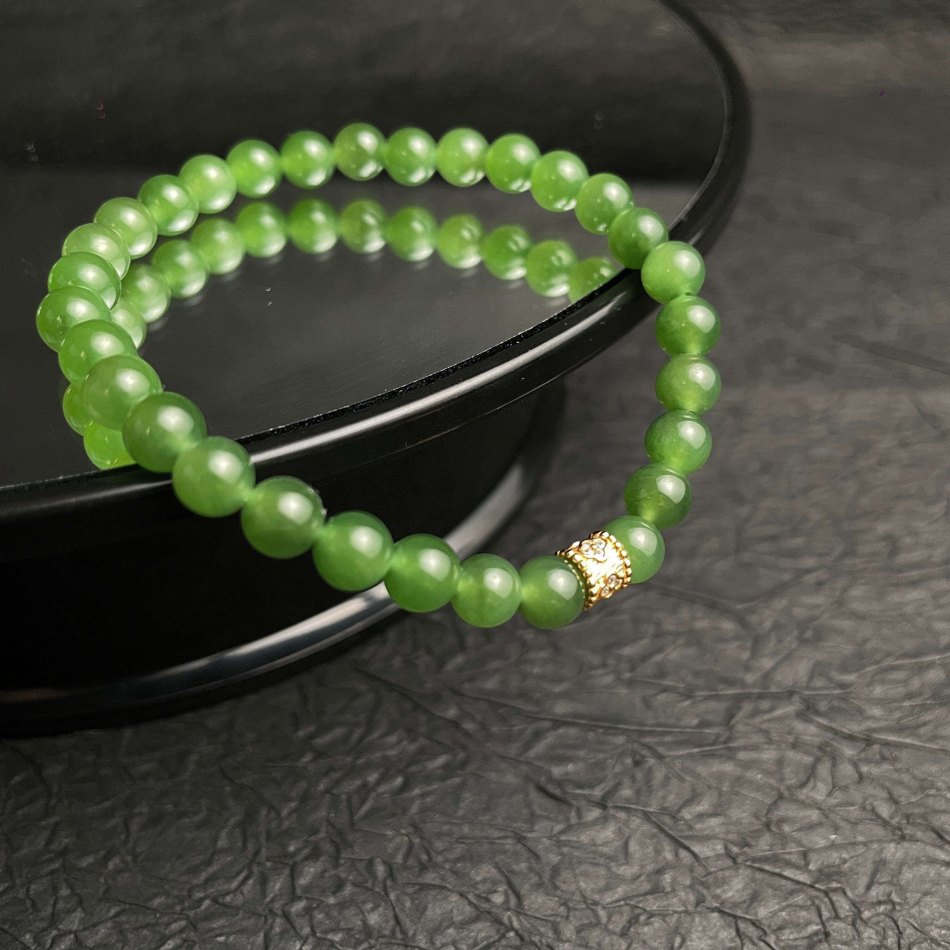 Sylvia Jewelry Imperial Forest natural green Hetian jade bracelet with gold-plated silver accent bead.