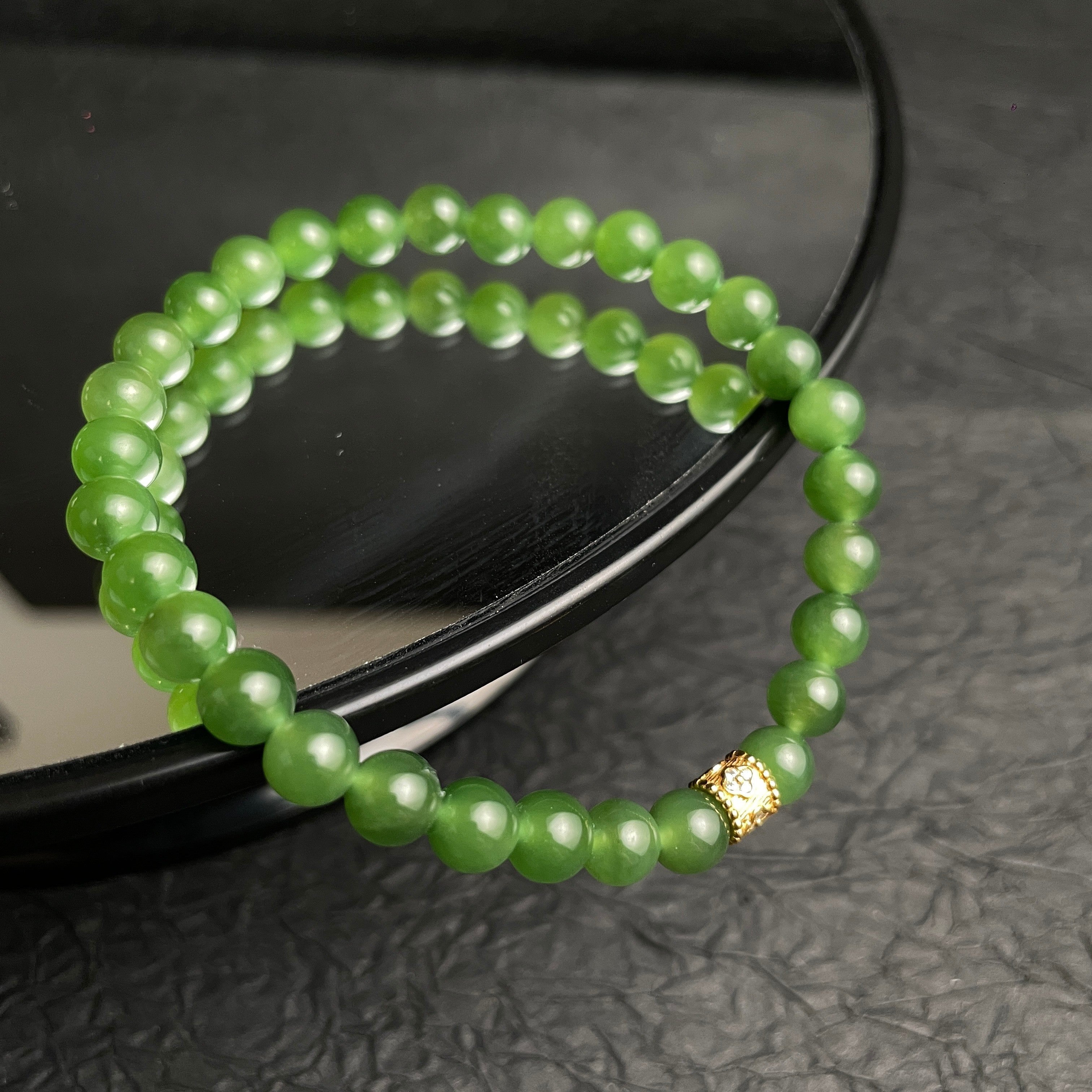 Sylvia Jewelry Imperial Forest Hetian green jade beaded bracelet with gold-plated silver accent bead.