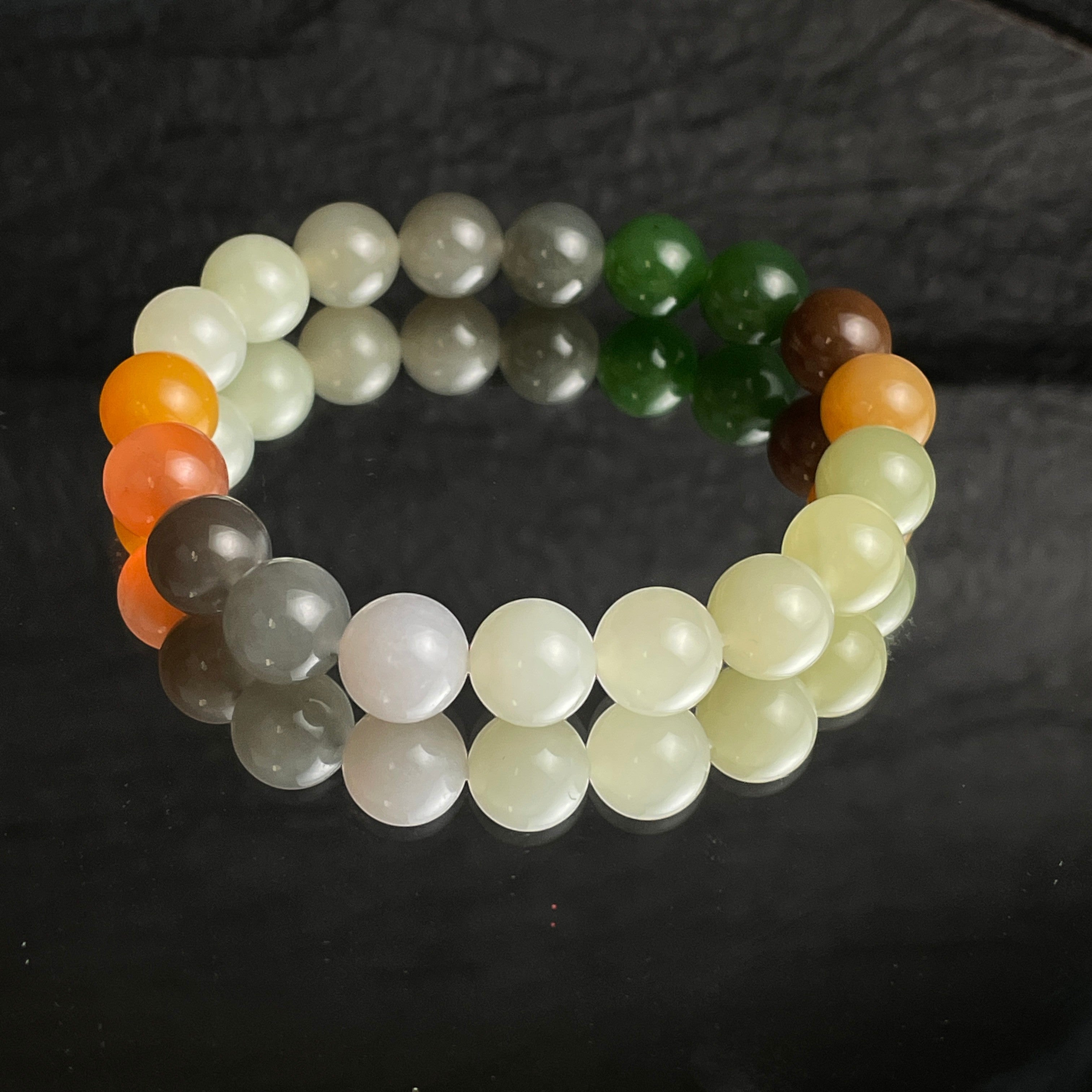 Sylvia Jewelry Harmony Matrix multi-color natural Hetian jade bracelet with white, green, smoky purple, brown, and orange beads.