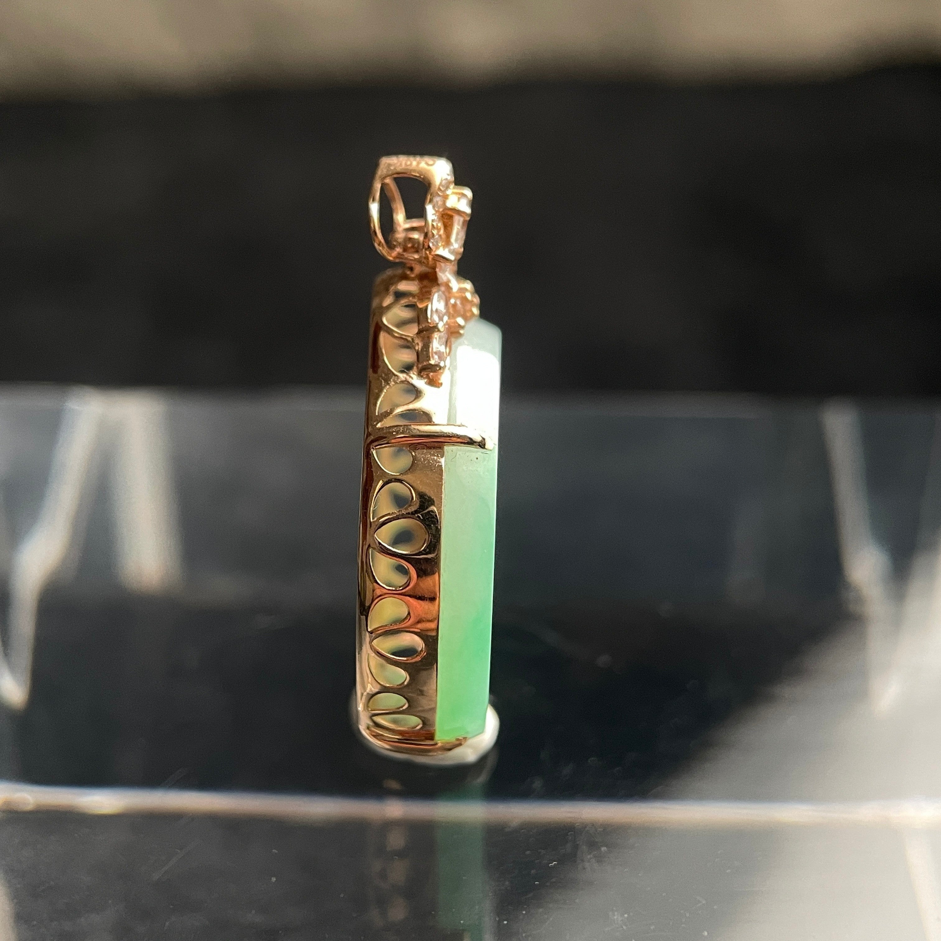 Sylvia Jewelry 18K rose gold and pale green jadeite oval pendant with a floral diamond-accented bail, side view.