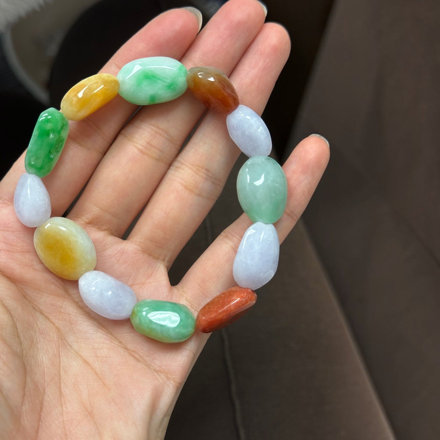 Sylvia Jewelry multi-color jadeite pebble bracelet featuring polished green, yellow, red, and lavender jade stones.