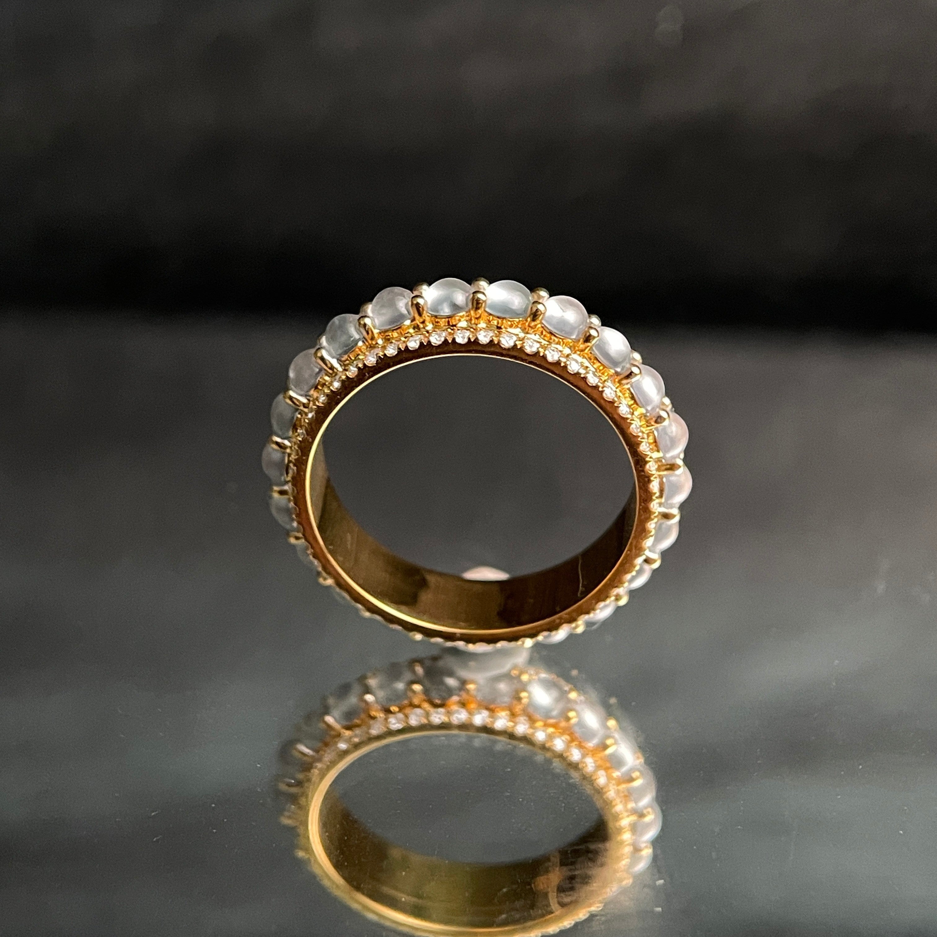 Sylvia Jewelry 18K gold ring with rotating white jadeite cabochons and small diamonds.