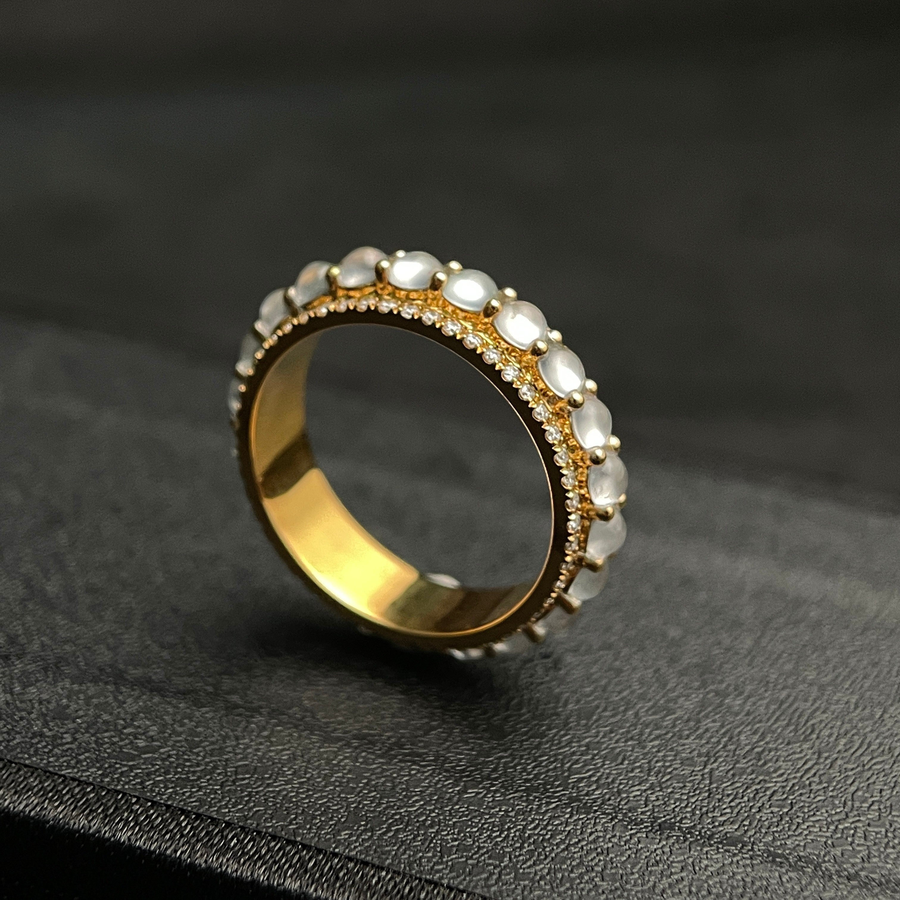 Sylvia Jewelry 18K gold band ring with rotating white jadeite cabochons and small diamonds.