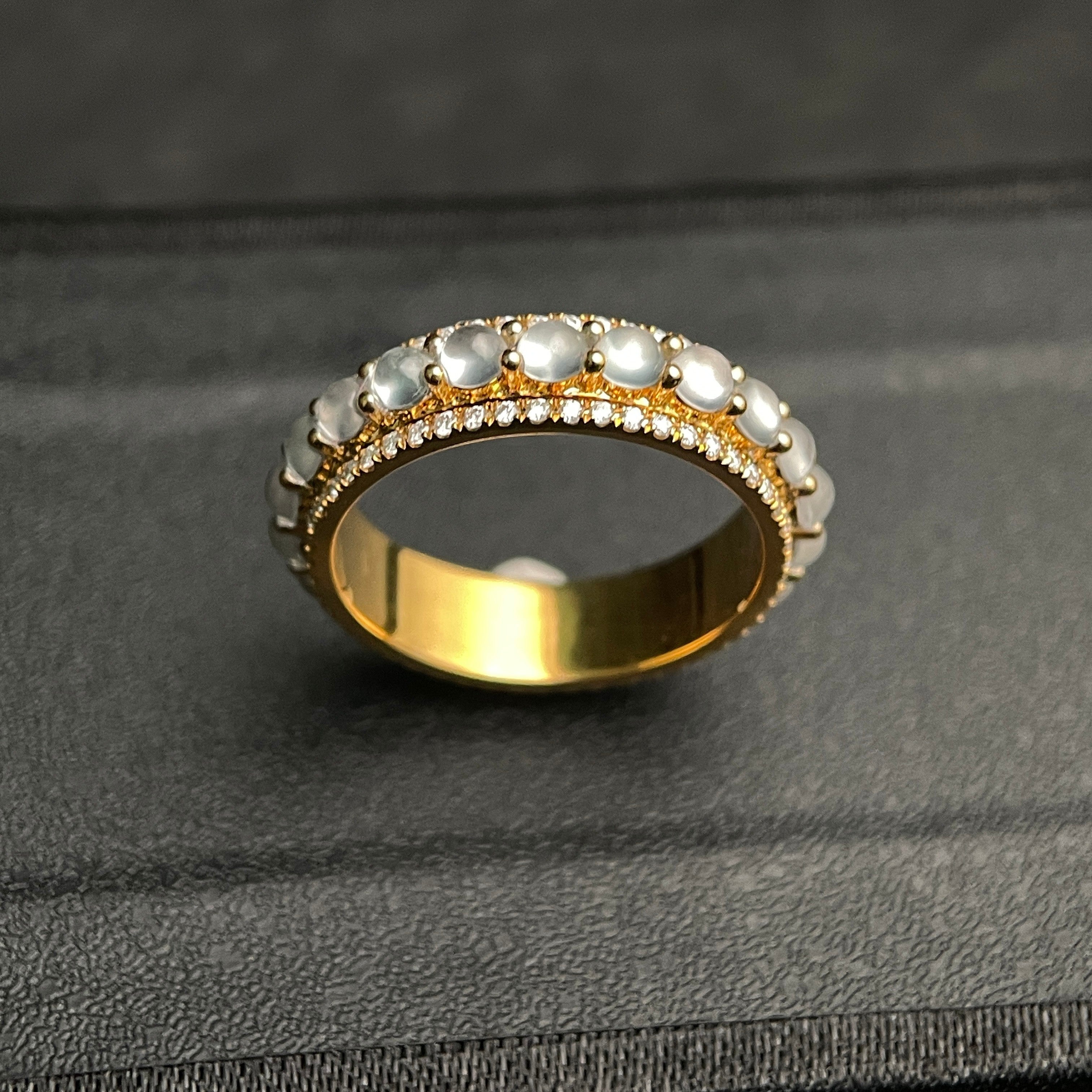 Sylvia Jewelry 18K gold ring with rotating white jadeite cabochons and diamond accents.