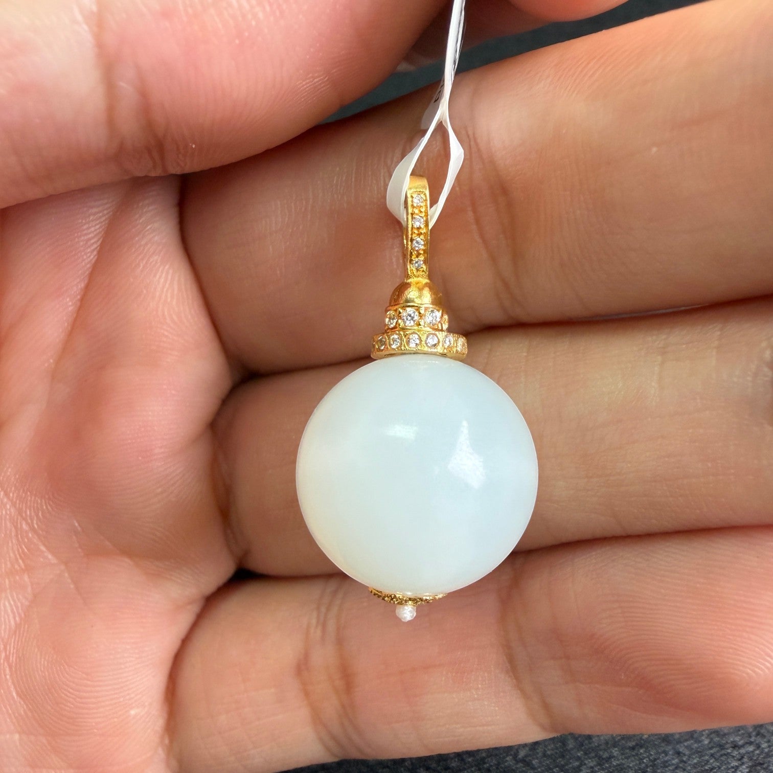 Sylvia Jewelry Celestial Sphere pendant featuring a white Hetian nephrite jade bead with 18k gold and micro-pavé diamonds.
