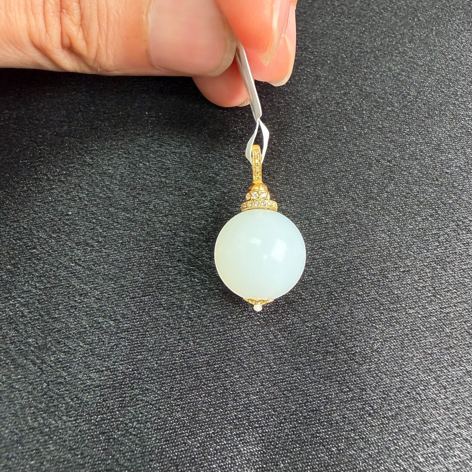 Sylvia Jewelry Celestial Sphere pendant featuring a white Hetian nephrite jade bead with 18k gold and micro-pavé diamonds.
