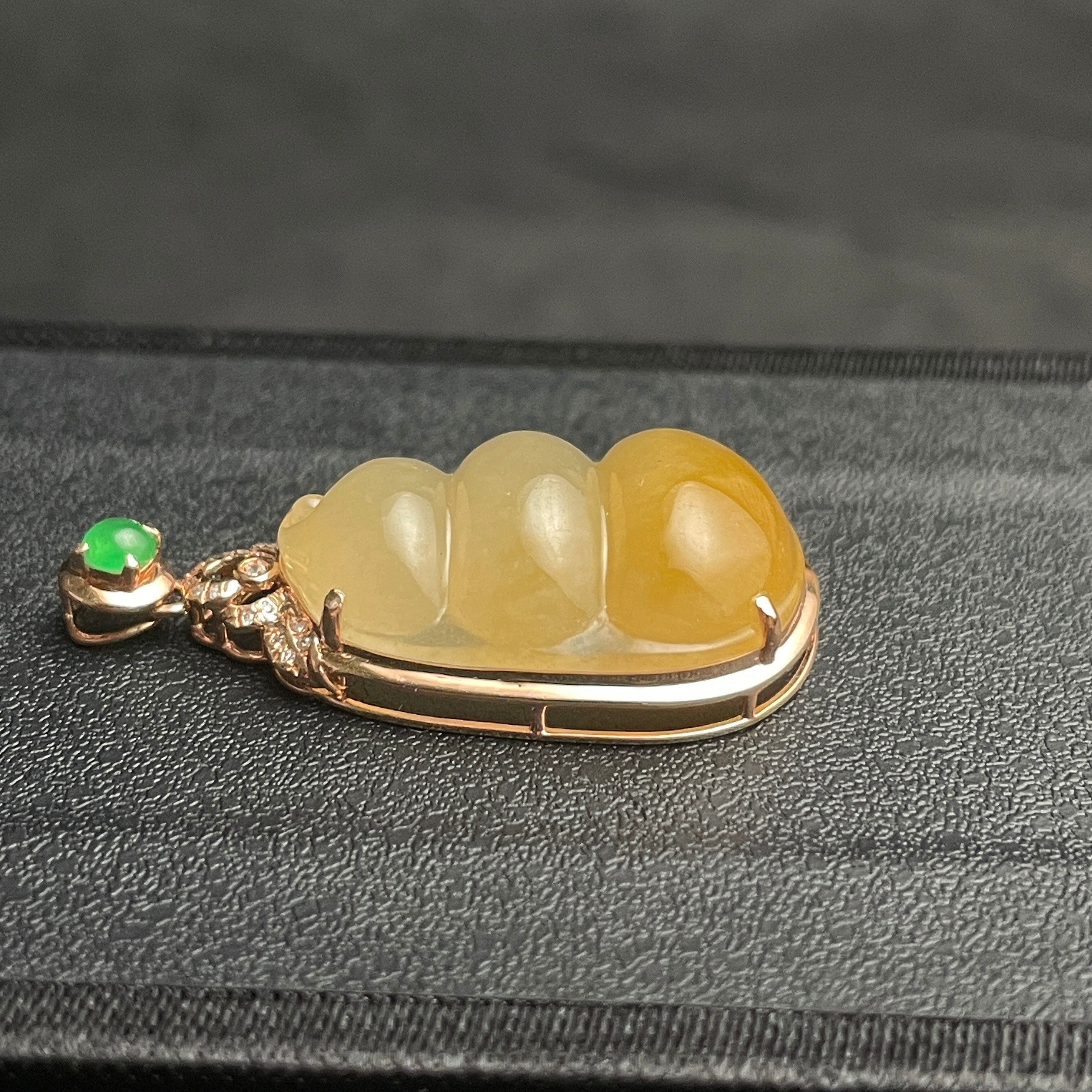 Sylvia Jewelry ice-species yellow jadeite fortune bean pendant with 18k gold, diamonds, and green jadeite accent.