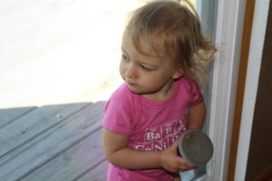 a toddler and her green smoothie