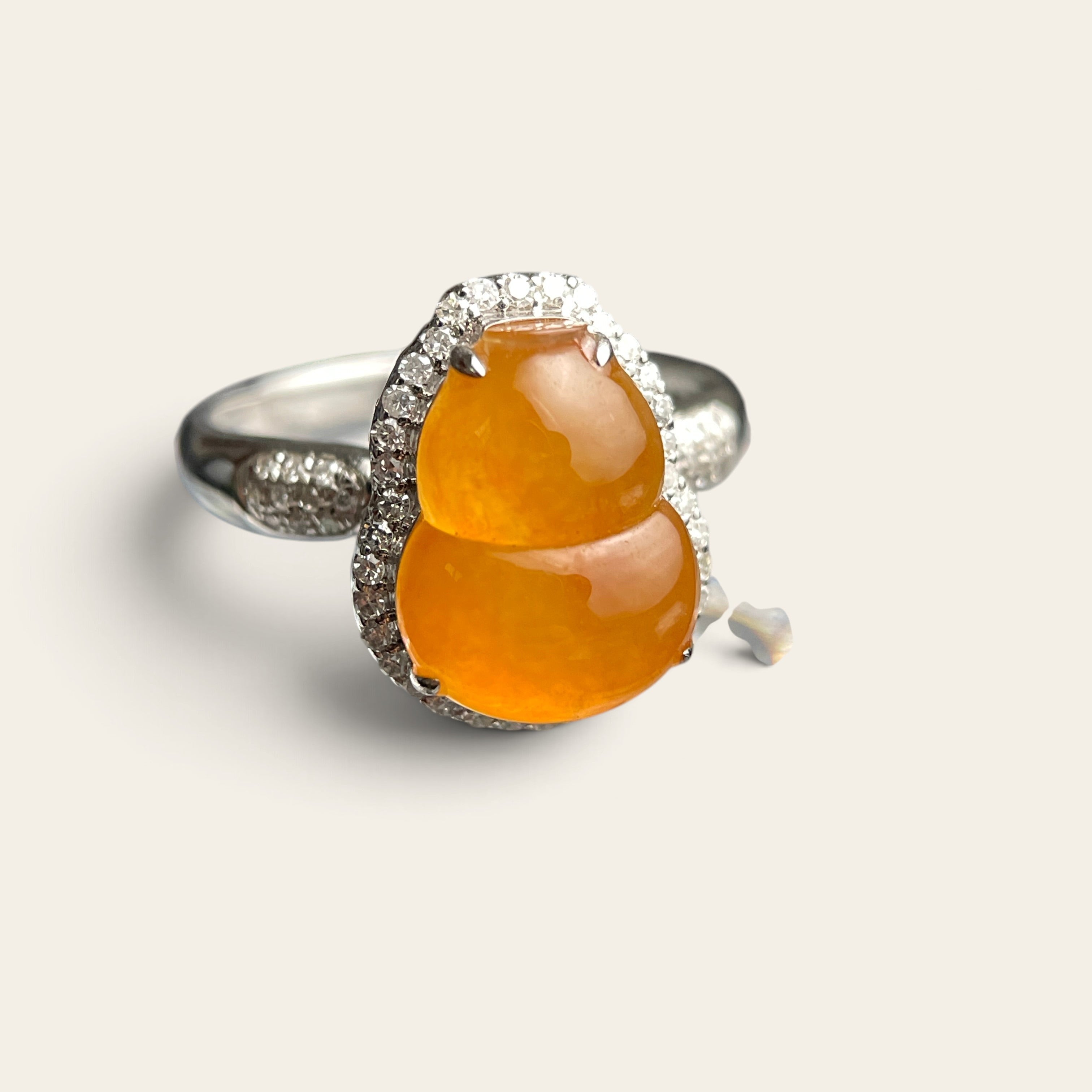Yellow jadeite gourd ring set in 18K white gold with diamond accents