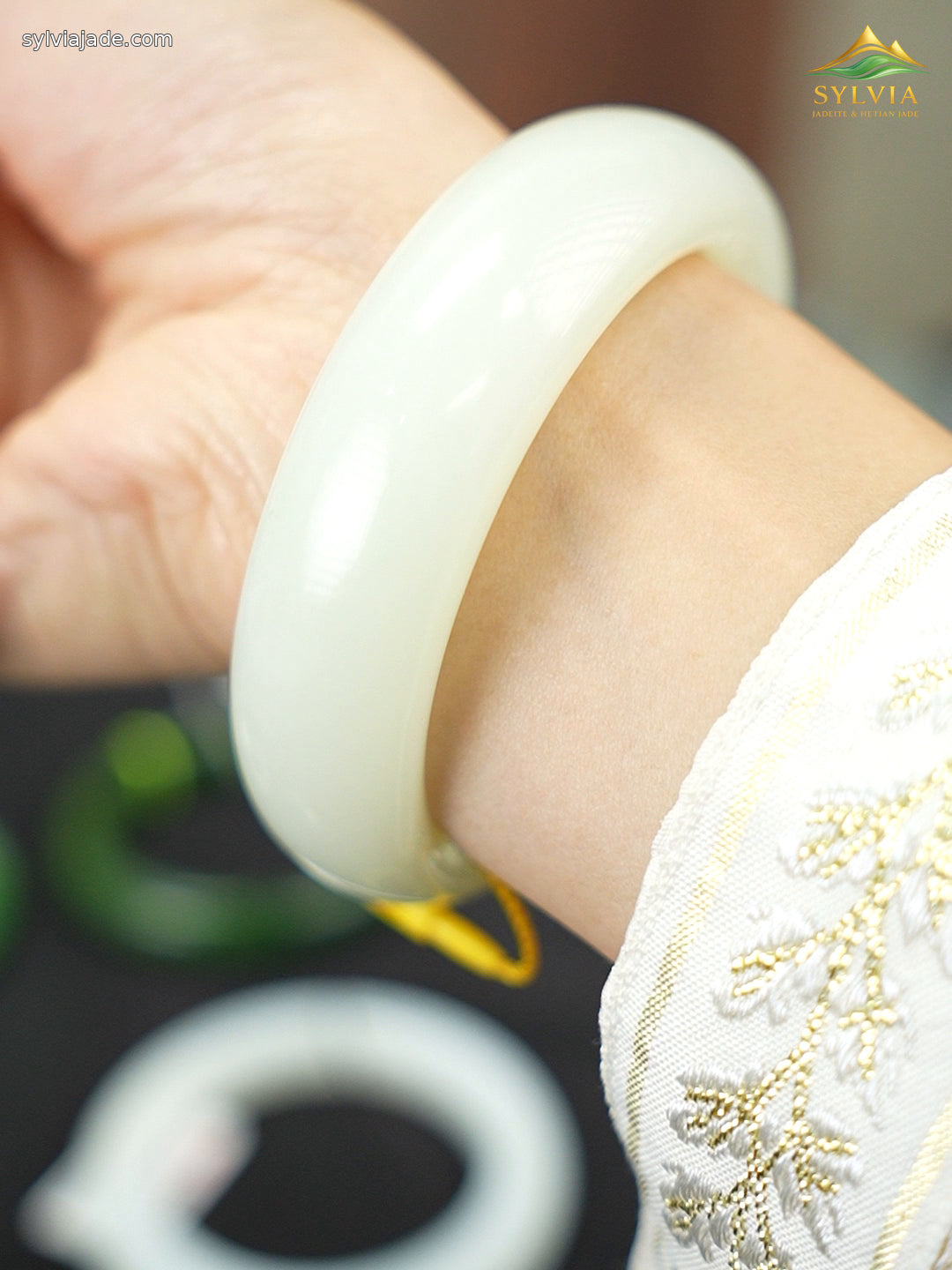 Pale green-white Hetian nephrite jade bangle B12609024874, worn angle 1