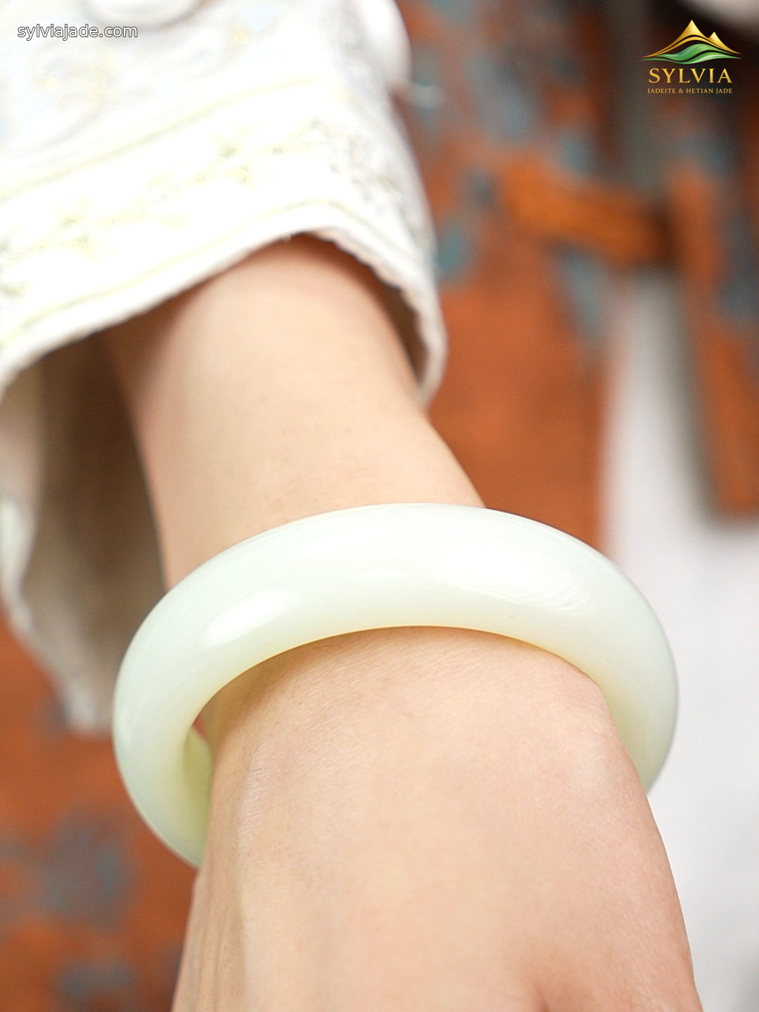 Pale green-white Hetian nephrite jade bangle B12609024874, worn angle 3