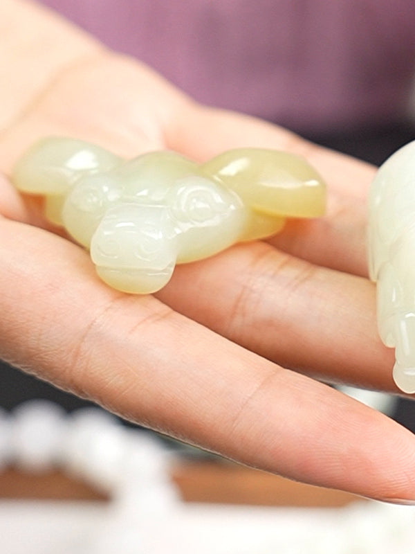 Hetian nephrite jade carved pendant B12609024905, hand-held view 2; pale pendant beside it is not included