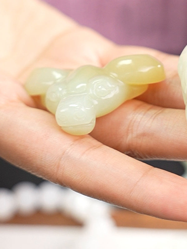 Hetian nephrite jade carved pendant B12609024905, hand-held view 3; pale pendant beside it is not included