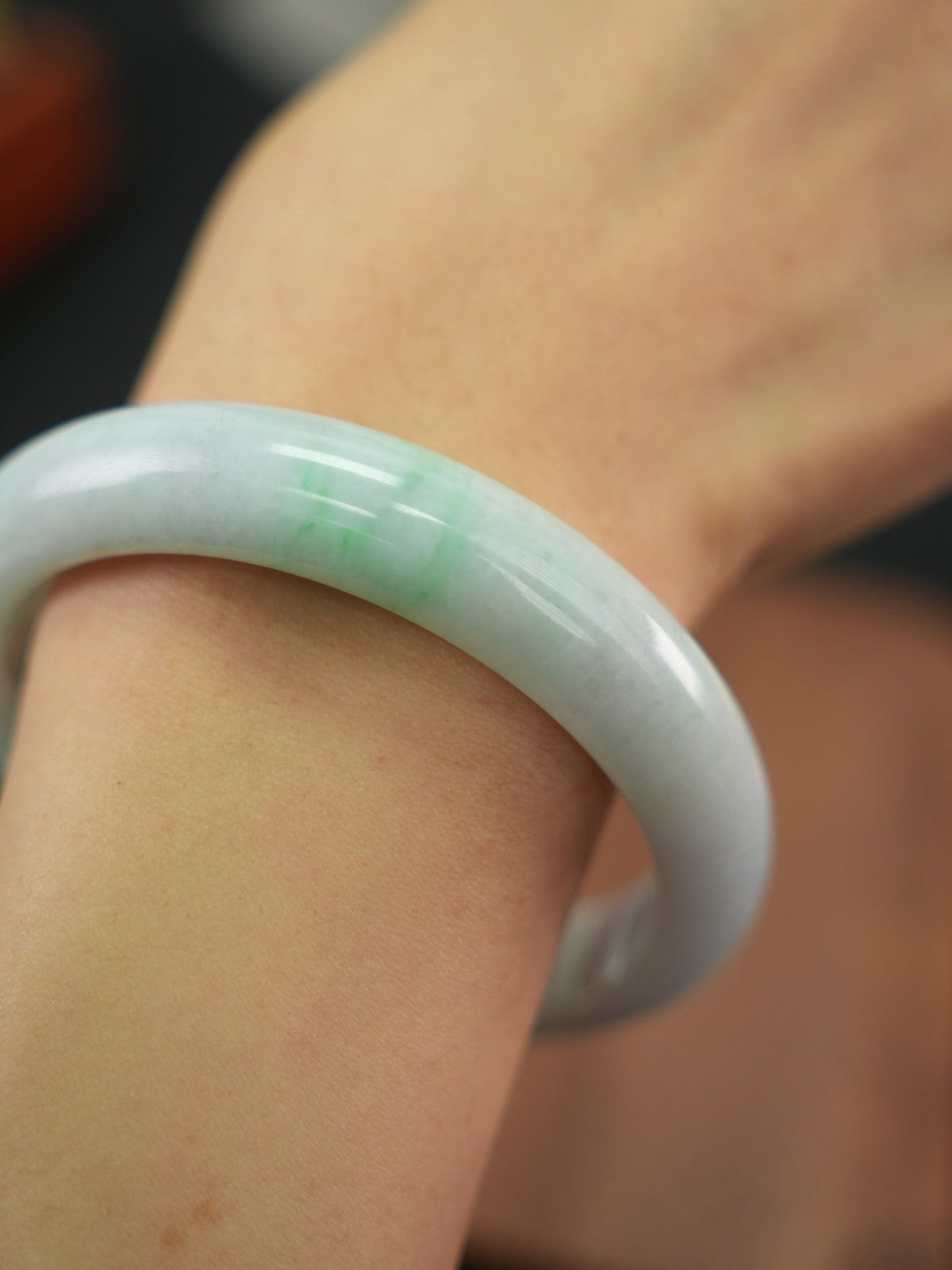 Natural Type A jadeite bangle, pale green and lavender, 61 mm
