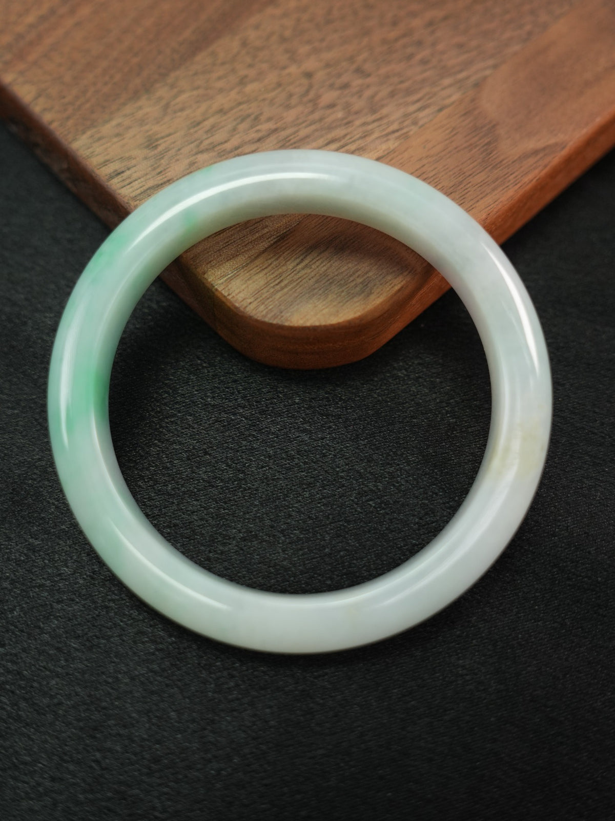 Natural Type A jadeite bangle, pale green and light lavender, 58 mm