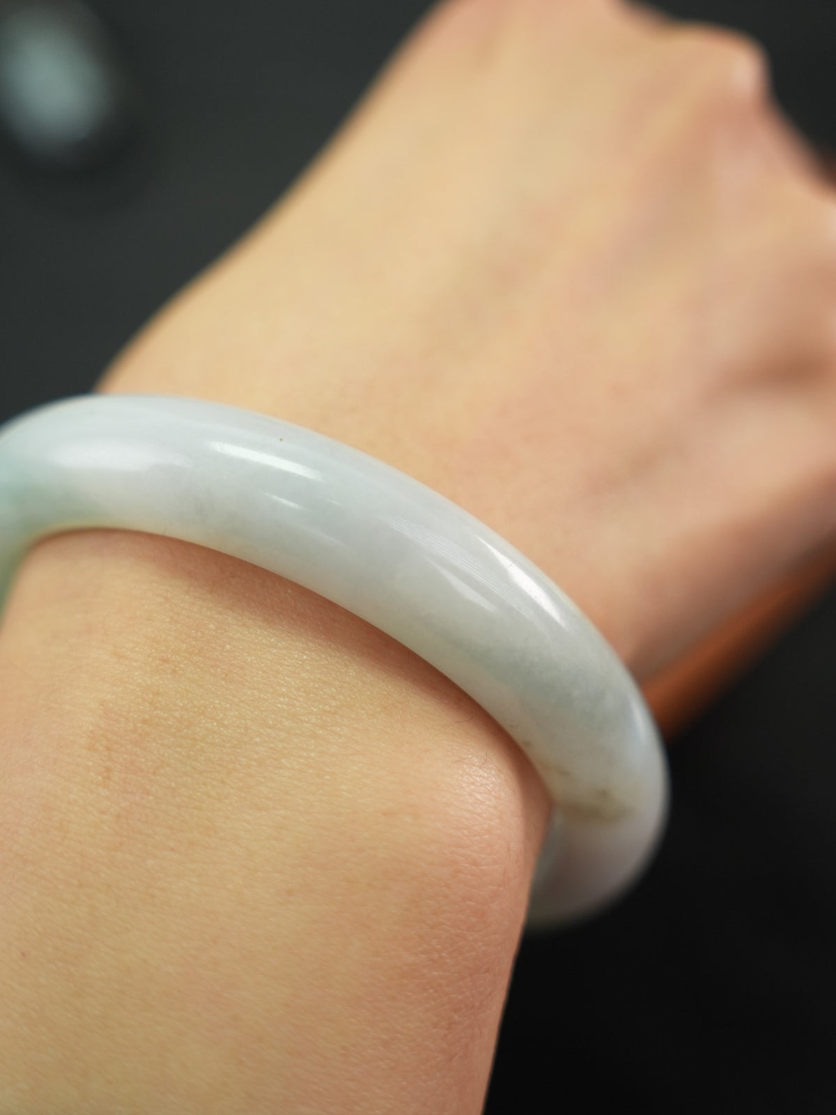 Natural Type A jadeite bangle, pale green and light lavender, 58 mm