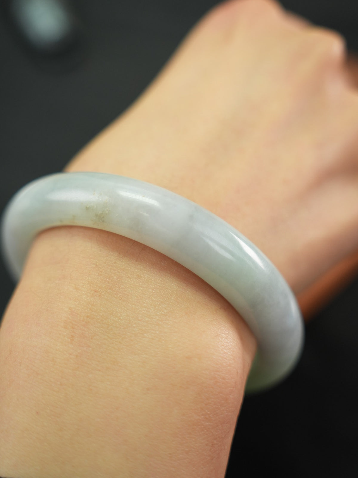 Natural Type A jadeite bangle, pale green and light lavender, 58 mm