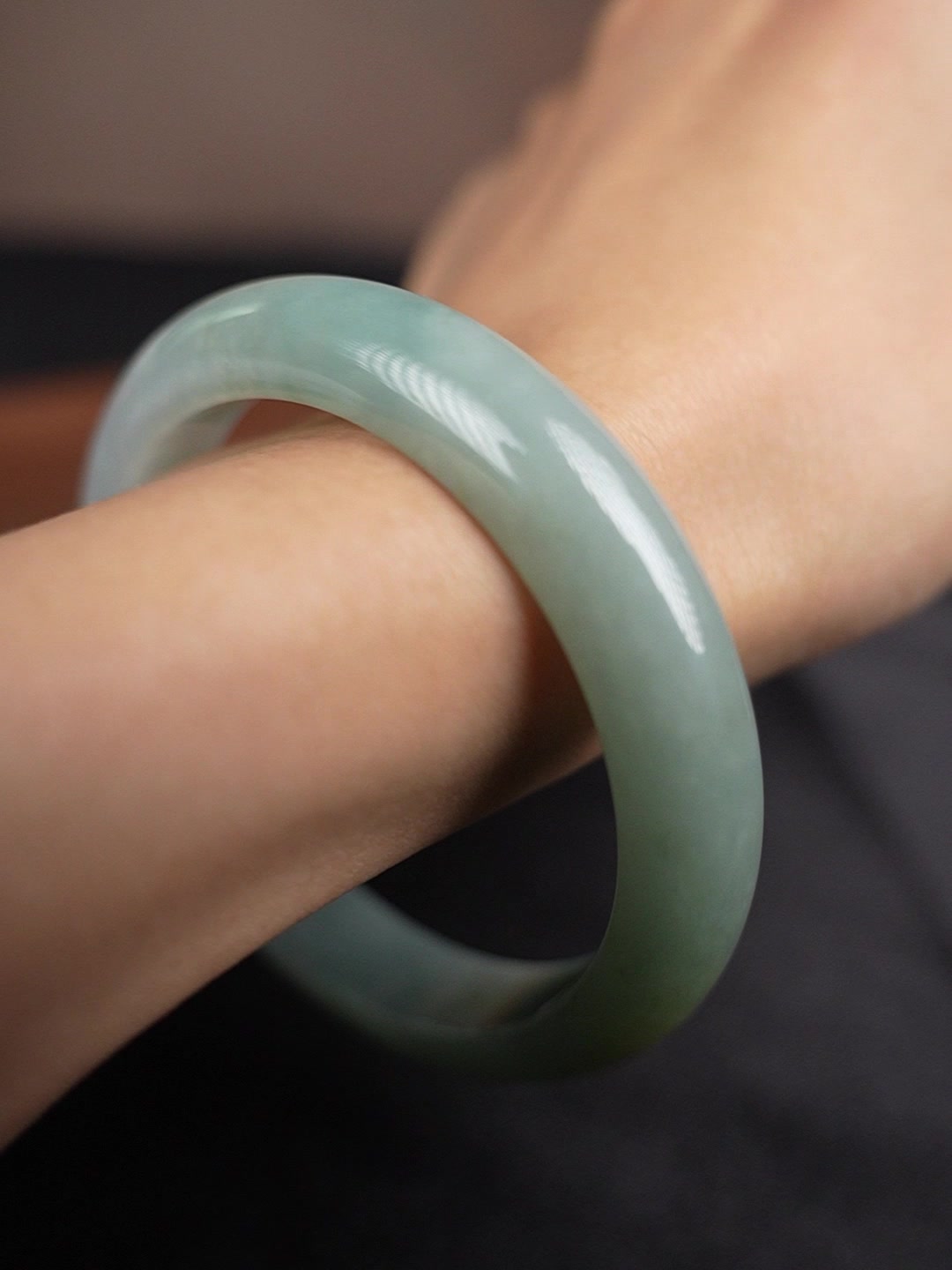 Pale green Type A jadeite bangle worn on wrist, angle 4