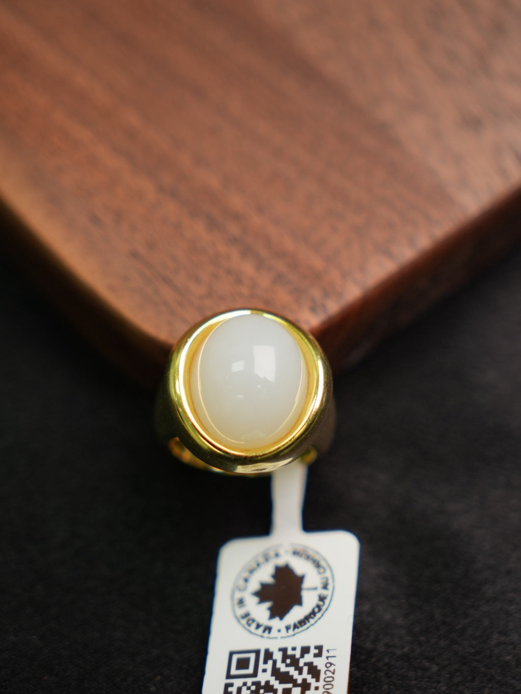 P2609002911 white Hetian nephrite jade ring in a gold-tone silver setting