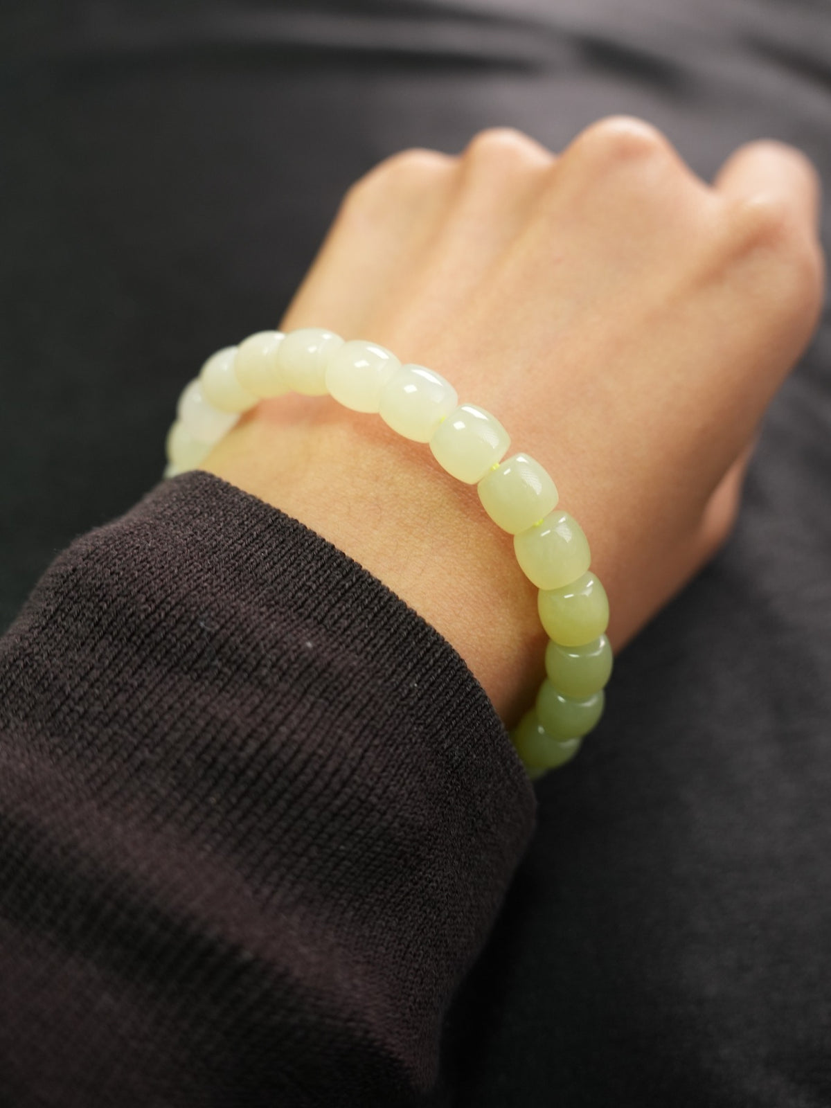 Pale yellow-green Hetian nephrite jade bracelet — product and wrist view