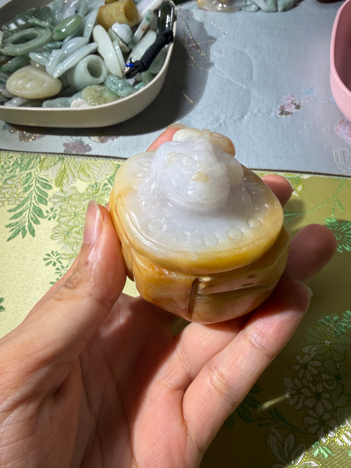 Carved jadeite ruyi frog display piece with white and honey-yellow tones