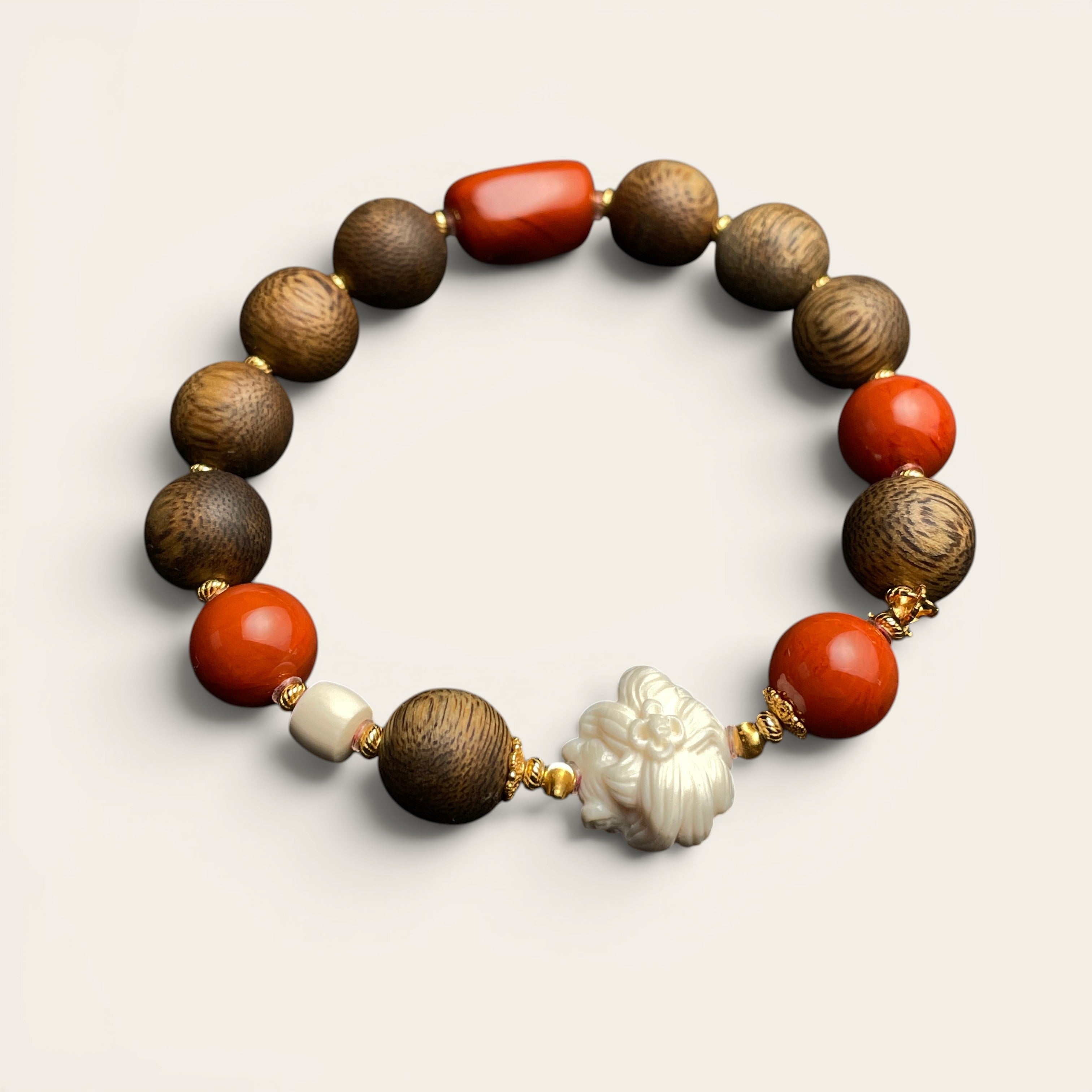 Sylvia Jewelry Forbidden Bloom bracelet featuring agarwood beads, red Nanhong agate, and a hand-carved white flower charm.