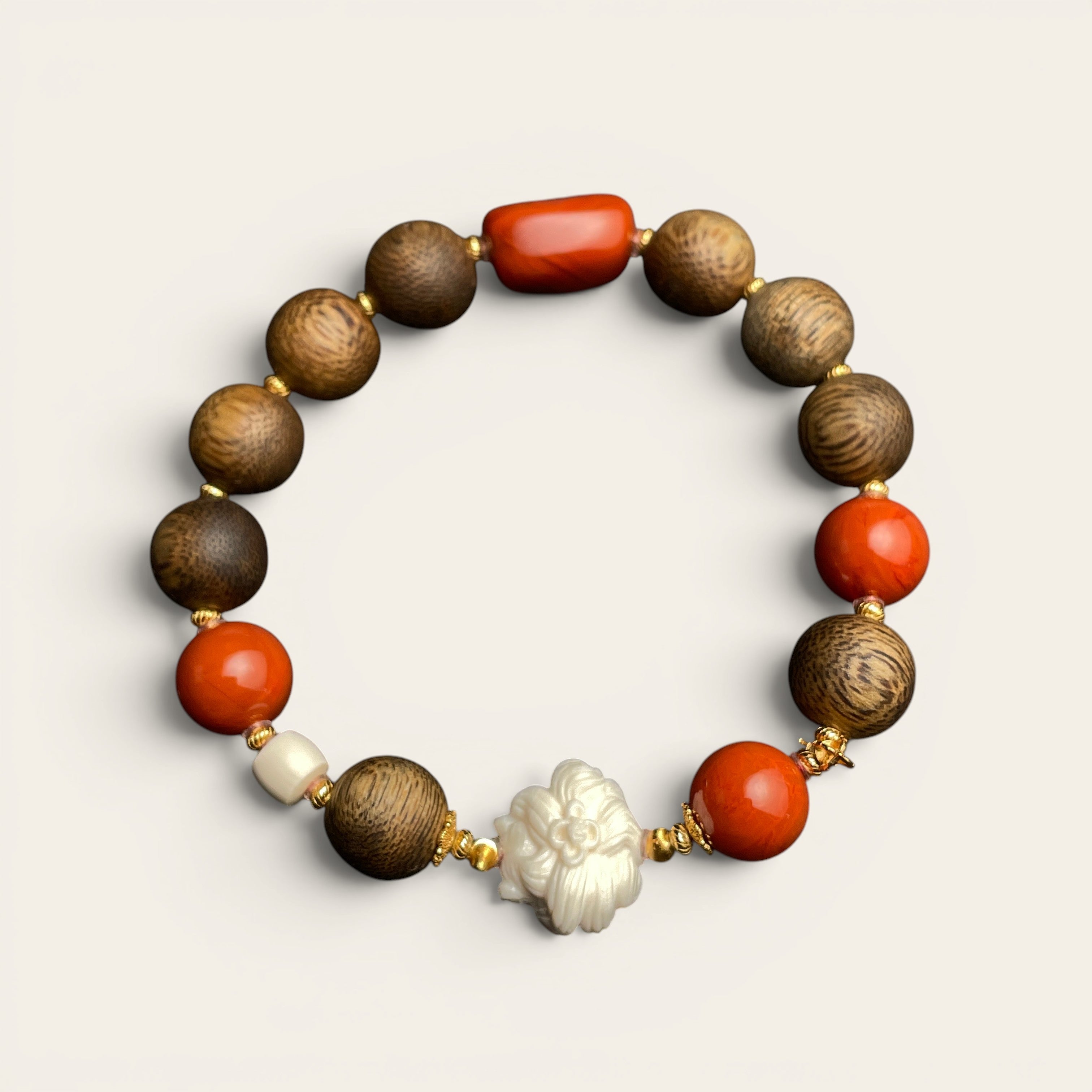 Sylvia Jewelry Forbidden Bloom bracelet featuring agarwood beads, red Nanhong agate, and a hand-carved white flower charm.