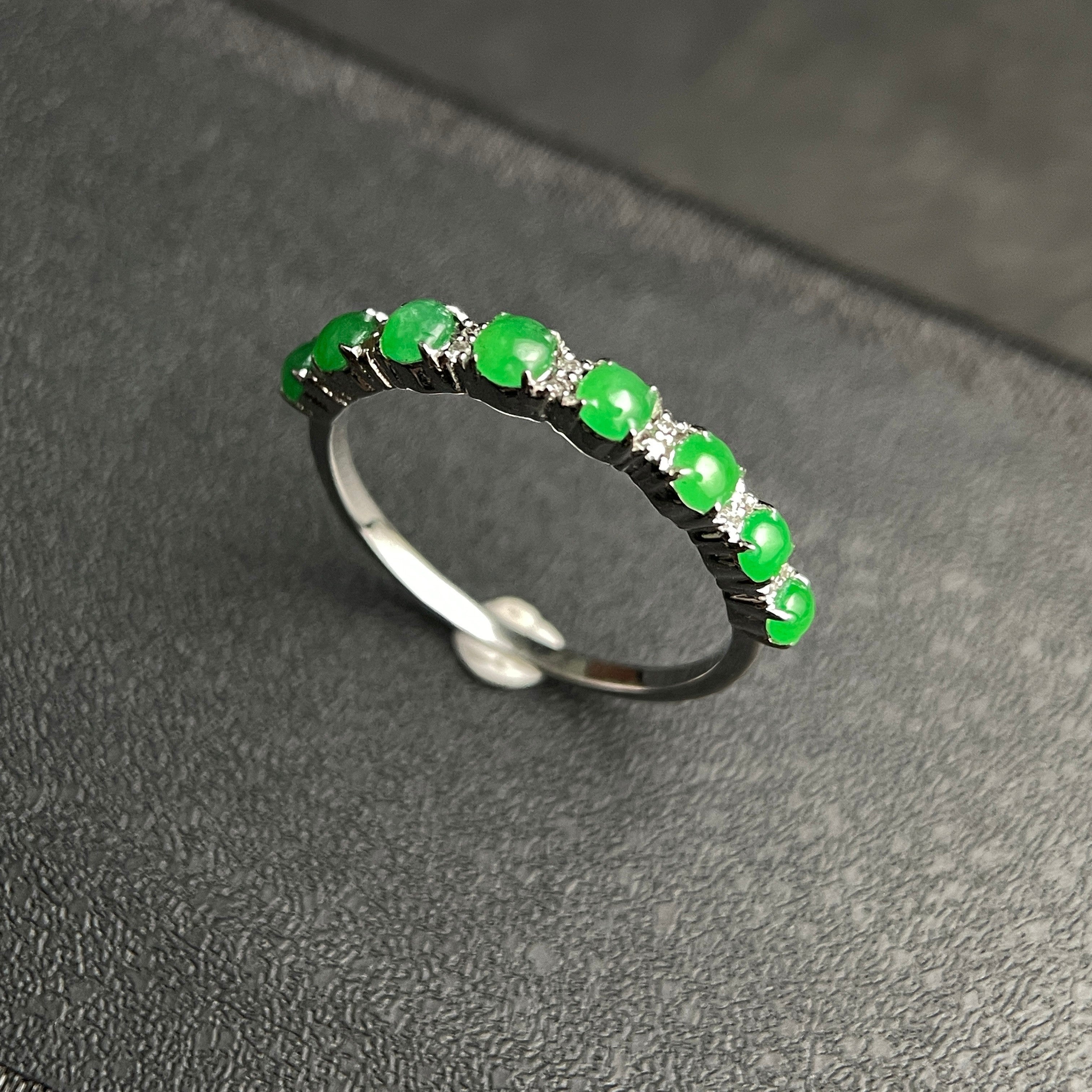 Sylvia Jewelry sterling silver band ring featuring a row of vibrant green jade cabochon stones.