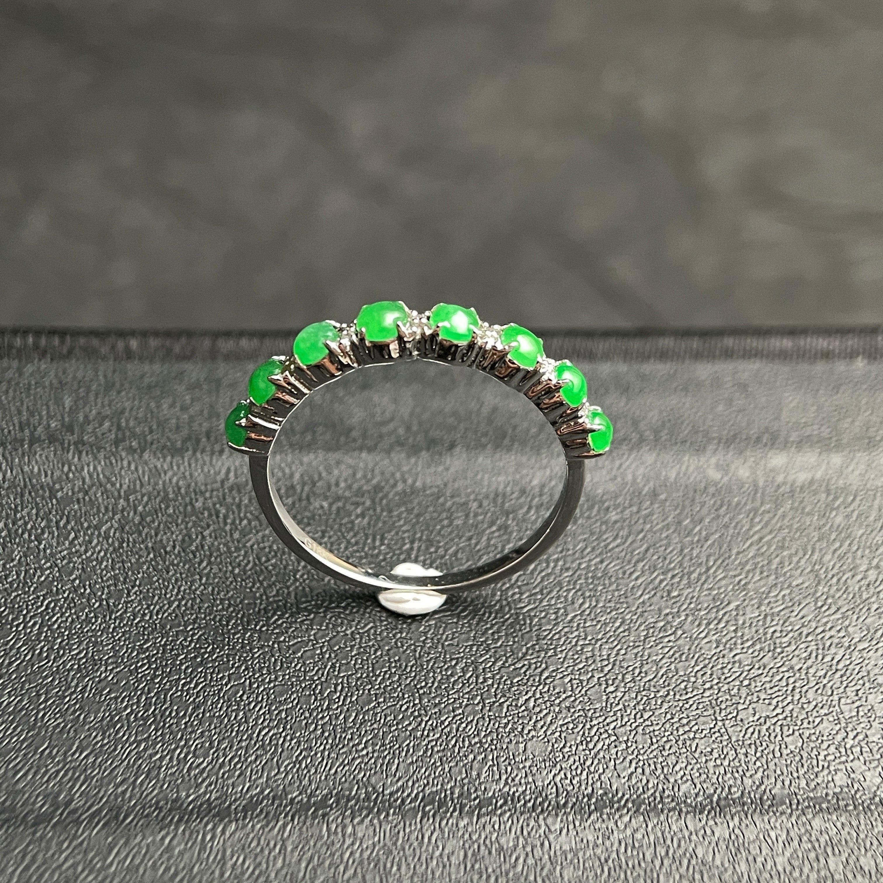 Sylvia Jewelry sterling silver ring featuring a row of vibrant green jade cabochon stones and small accent diamonds.