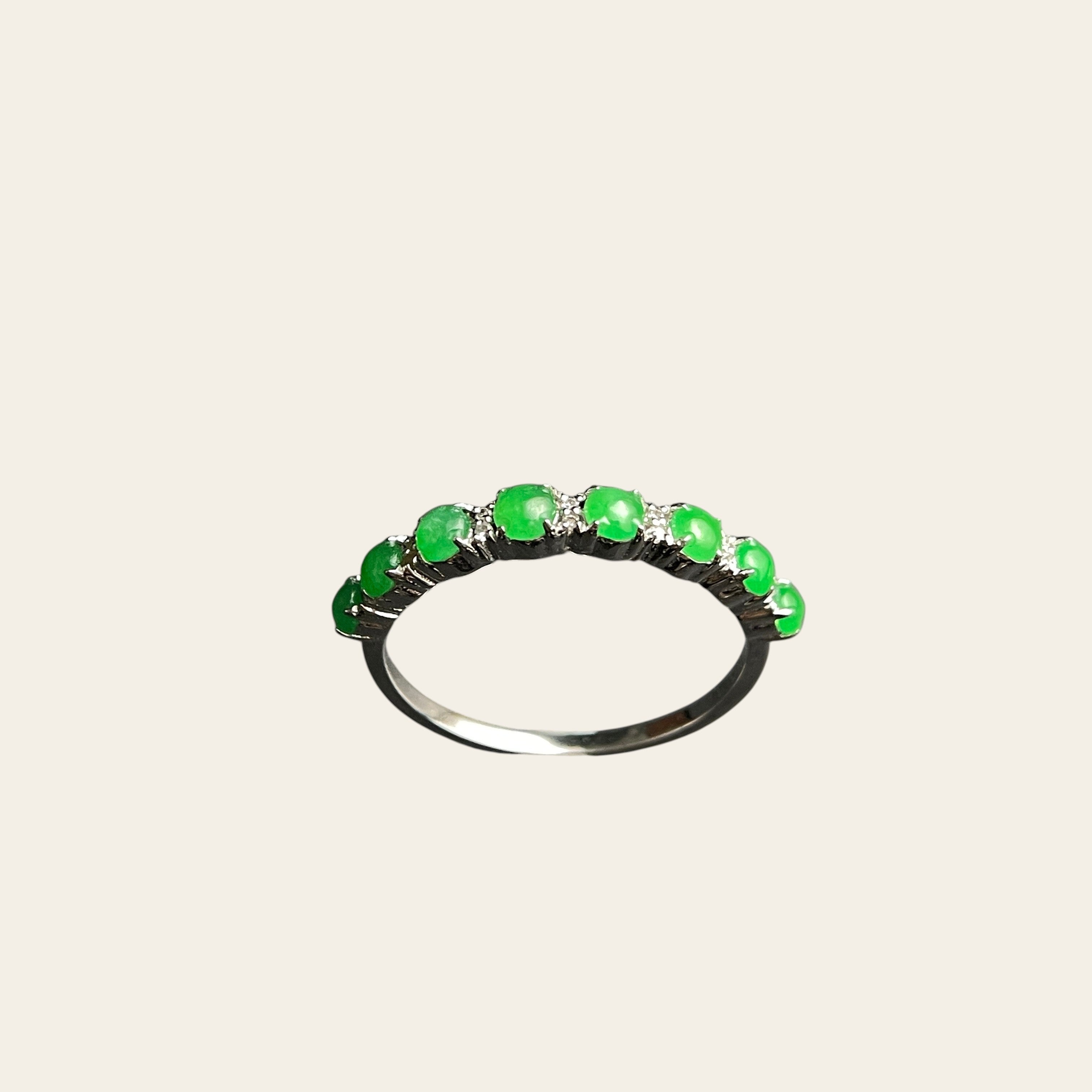Sylvia Jewelry sterling silver ring featuring a row of vibrant green jade cabochons and small accent diamonds.
