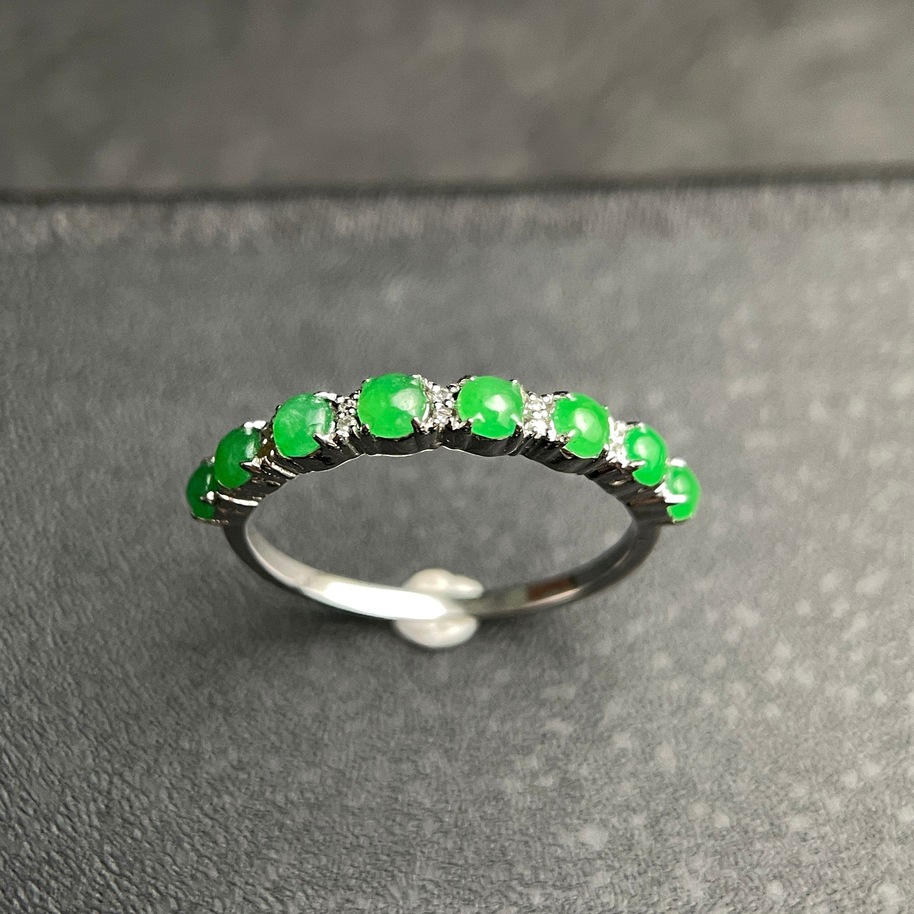 Sylvia Jewelry sterling silver ring featuring a row of vibrant green jade cabochons and small accent diamonds.