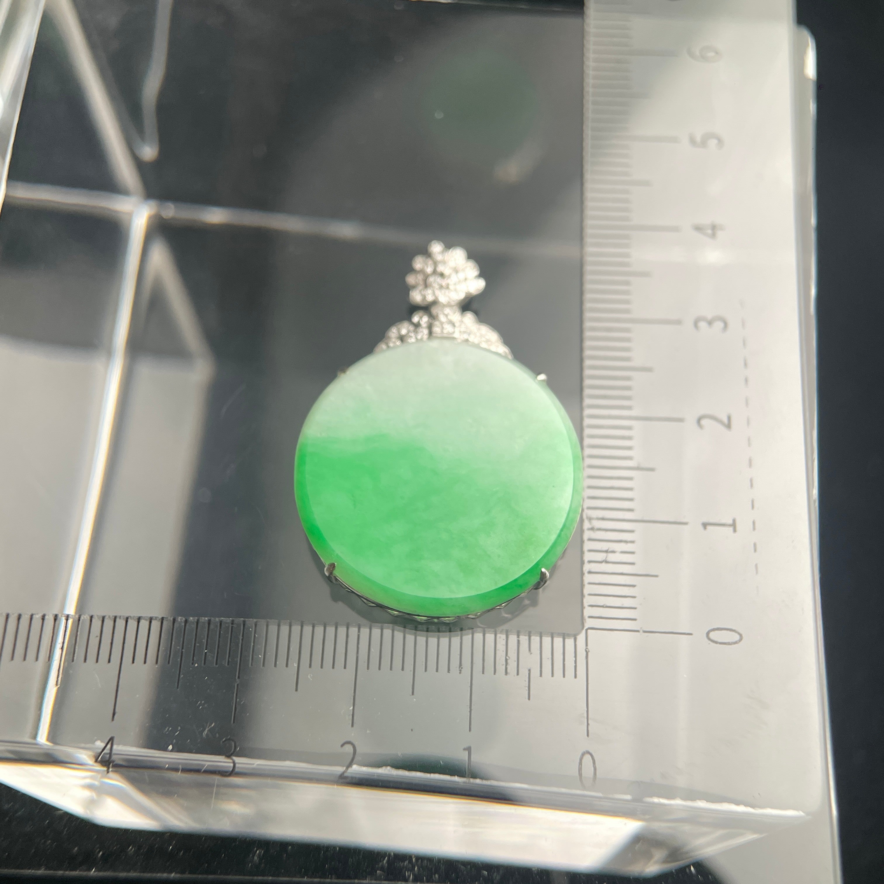 Sylvia Jewelry bright green jadeite jade pendant plaque in an 18K gold setting shown with a measurement scale