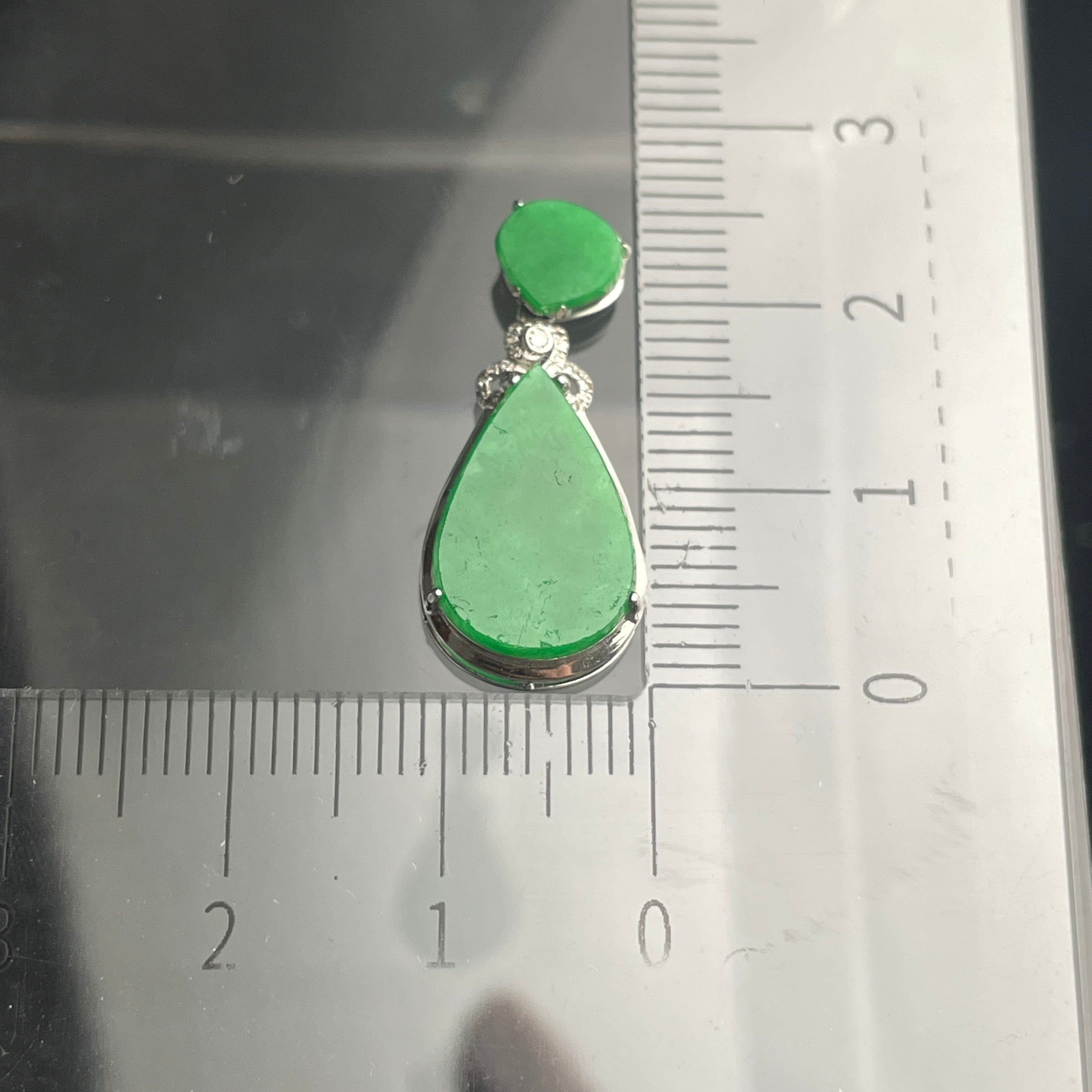 Sylvia Jewelry 18K gold teardrop pendant featuring vivid green jadeite cabochons and a floral diamond-accented bail.