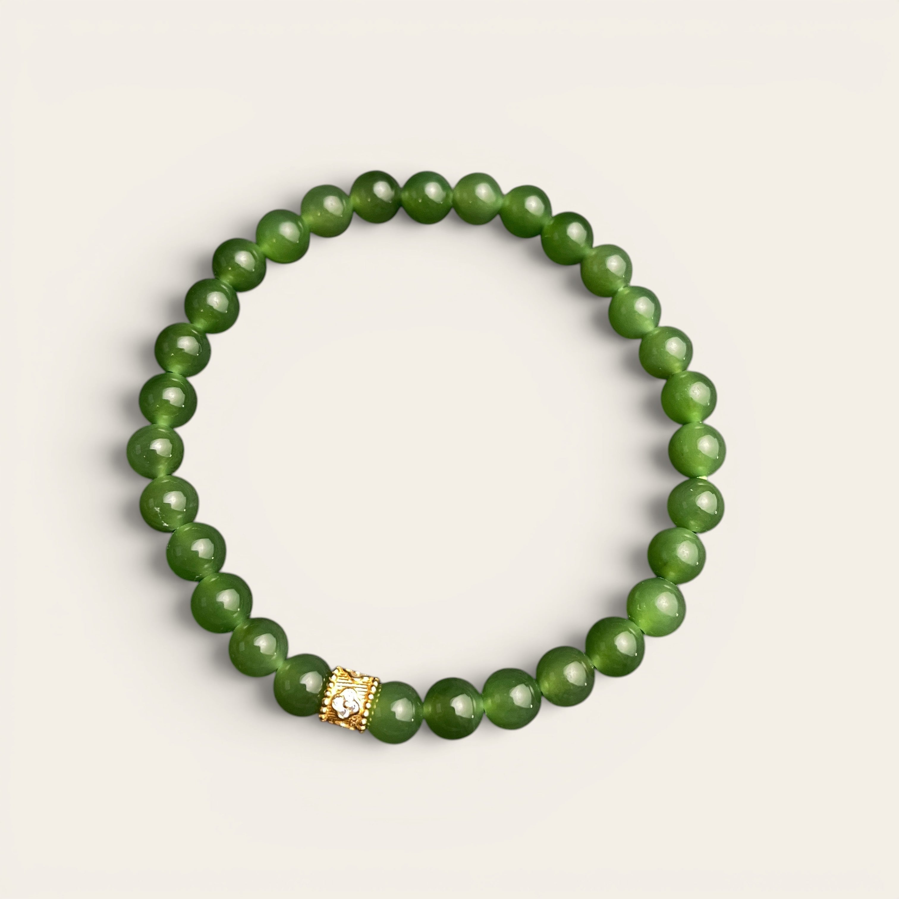 Sylvia Jewelry Imperial Forest bracelet with natural green Hetian jade beads and a gold-plated silver accent bead.