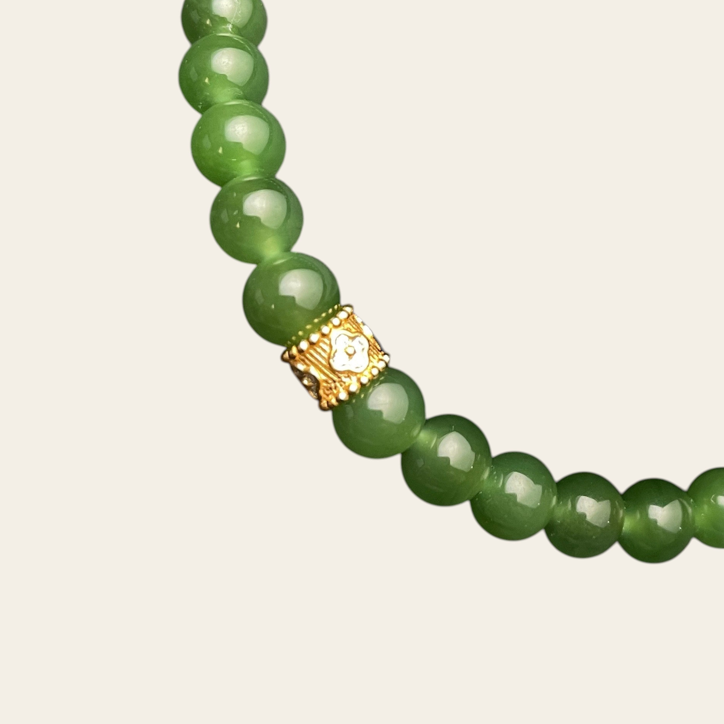 Sylvia Jewelry Imperial Forest bracelet with natural green Hetian jade beads and a gold-plated silver accent bead.