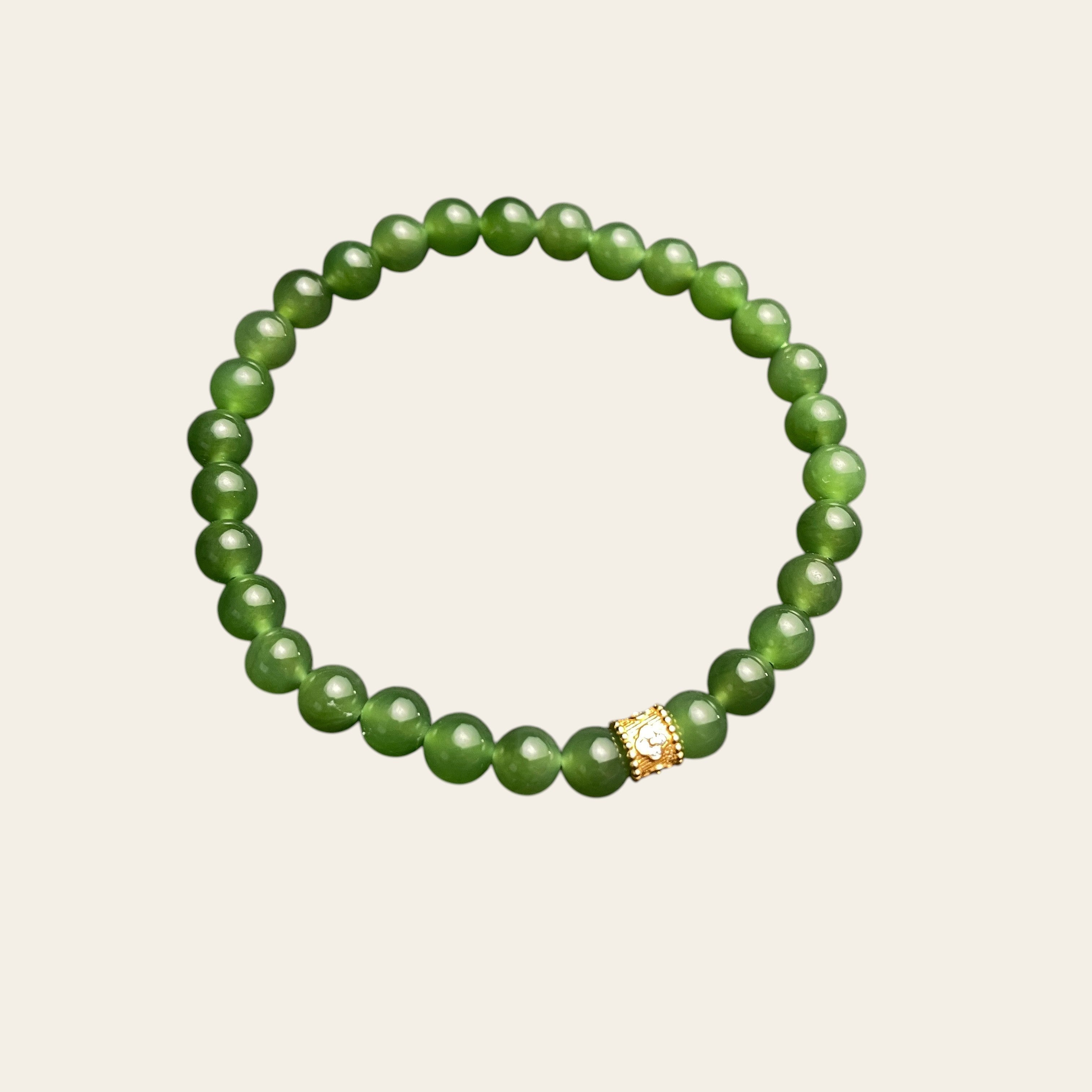 Sylvia Jewelry Imperial Forest bracelet with natural green Hetian jade beads and a gold-plated silver accent bead.