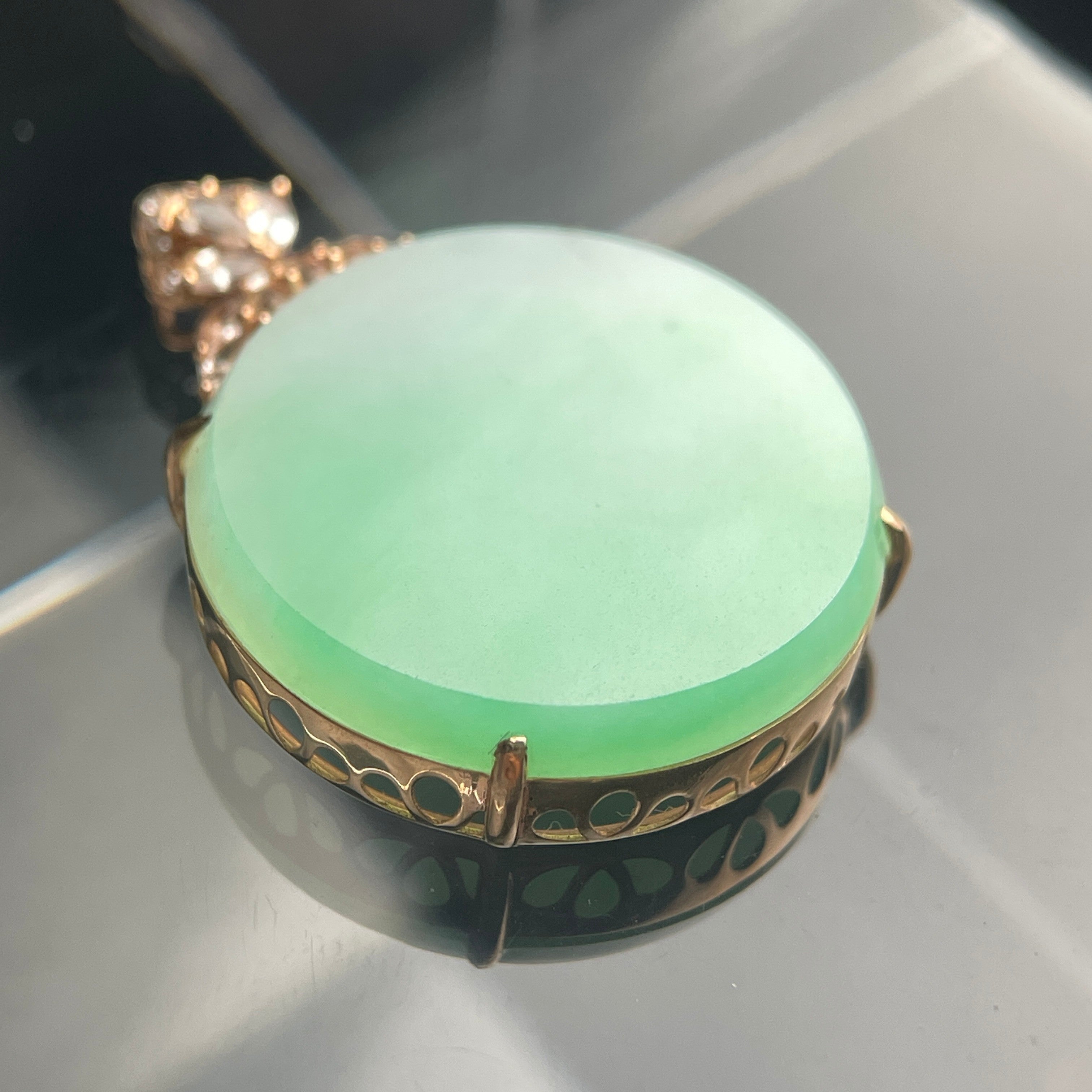 Sylvia Jewelry celadon jadeite oval pendant in 18K rose gold with a floral diamond-accented bail.