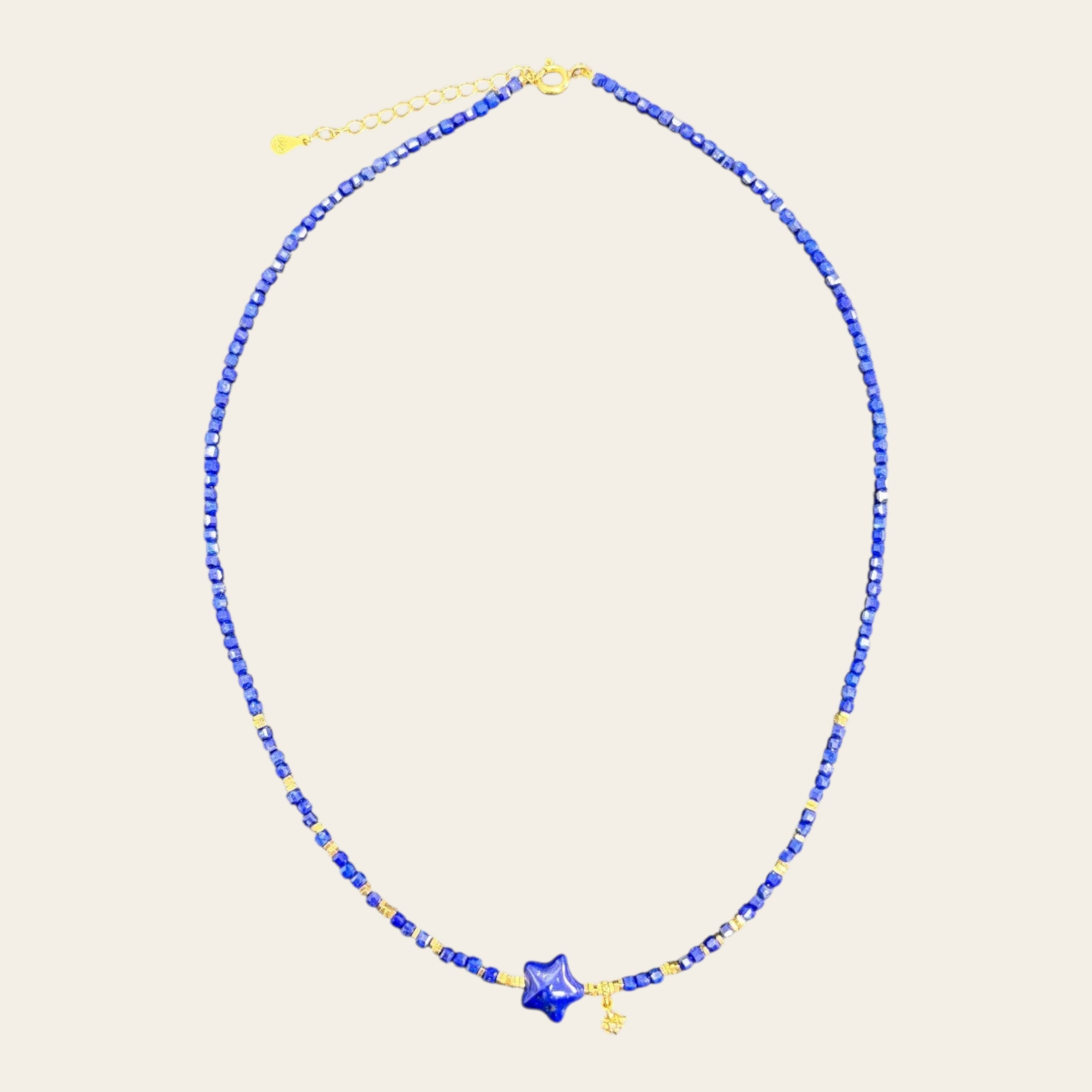 Sylvia Jewelry Celestial Night lapis lazuli beaded choker with gold-plated star pendant and delicate charm.