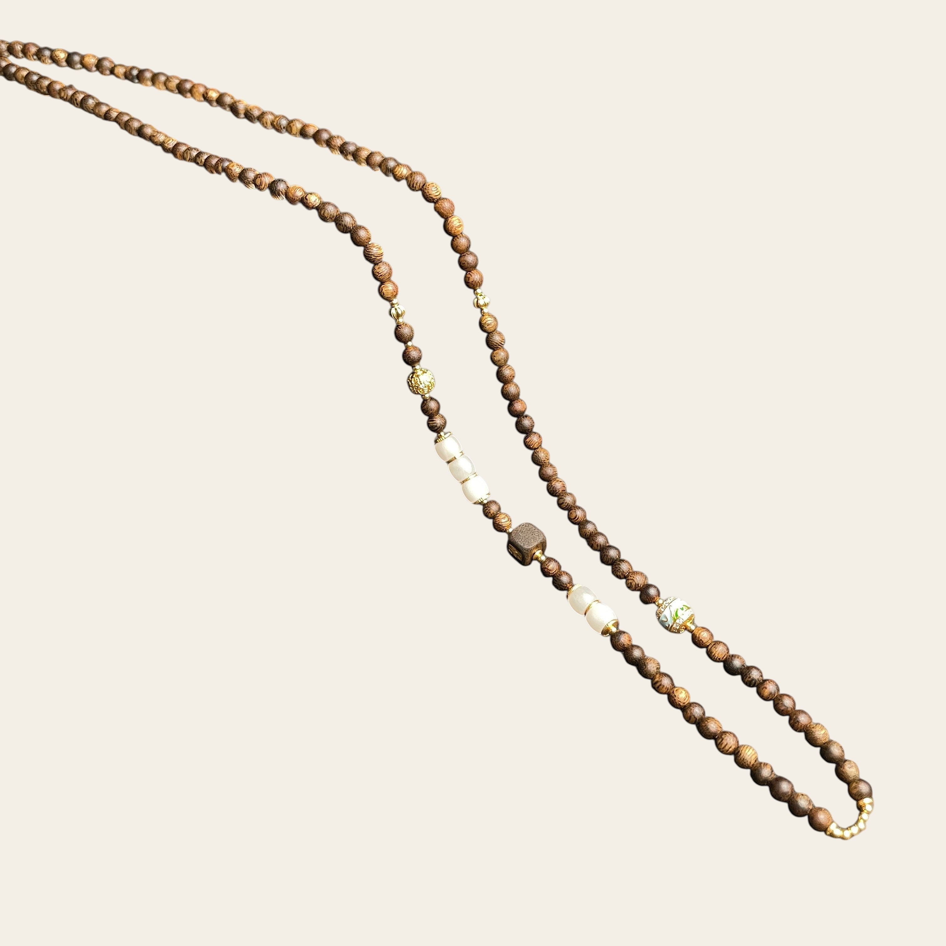 Sylvia Jewelry long wooden bead necklace featuring white stone accents and gold-toned decorative spacers