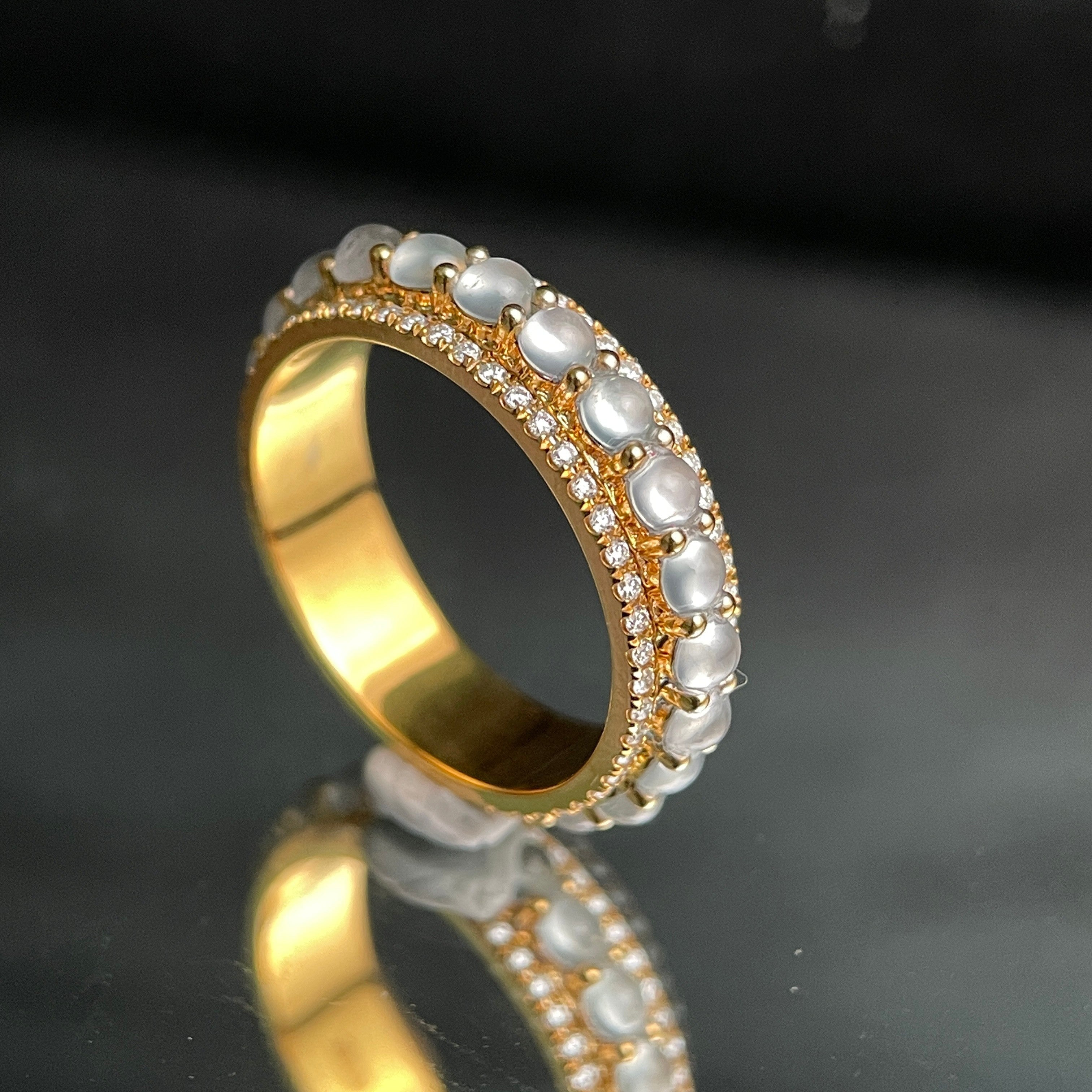 Sylvia Jewelry 18K gold band ring with rotating white jadeite cabochons and small diamonds.