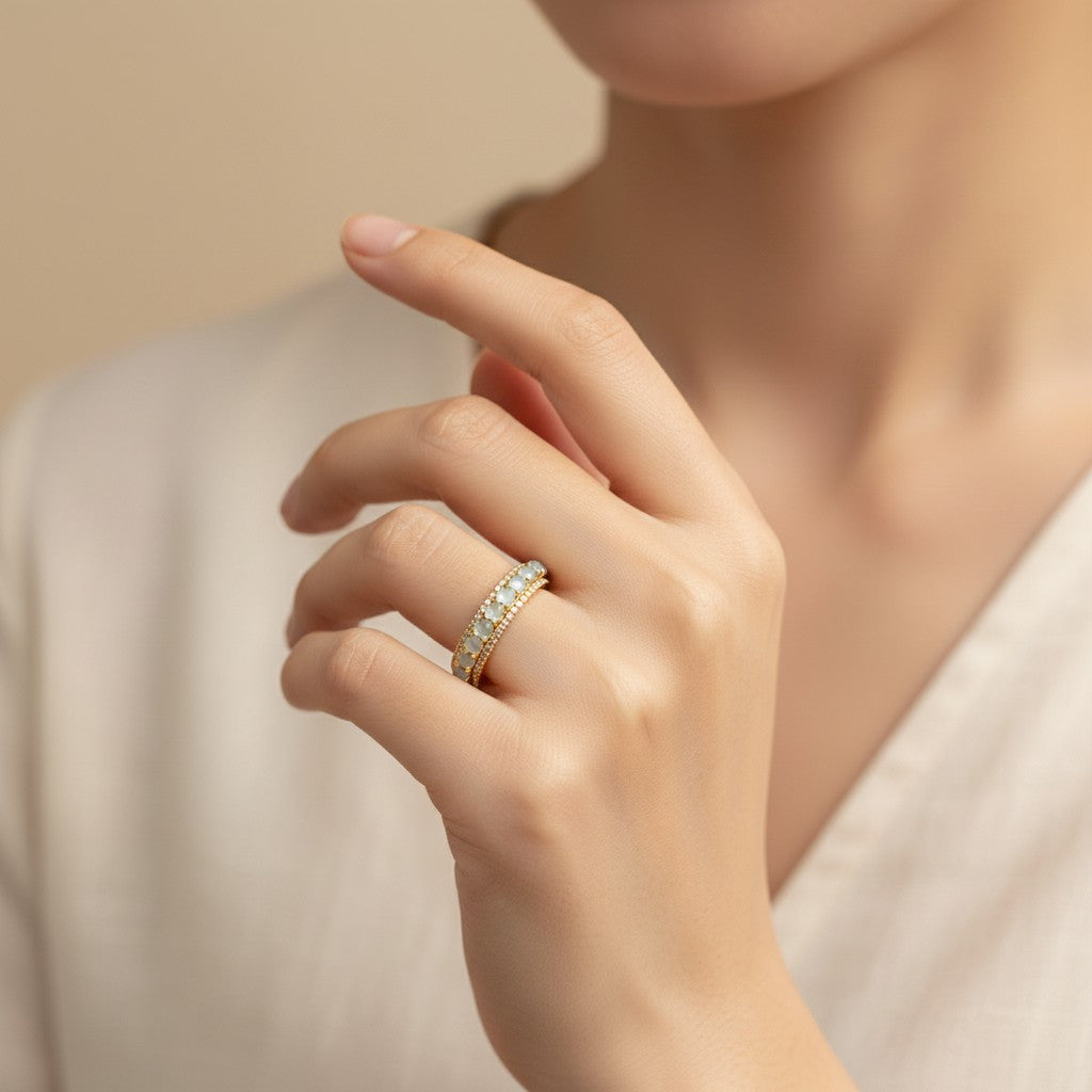 Sylvia Jewelry 18K gold ring with rotating white jadeite cabochons and diamond accents.